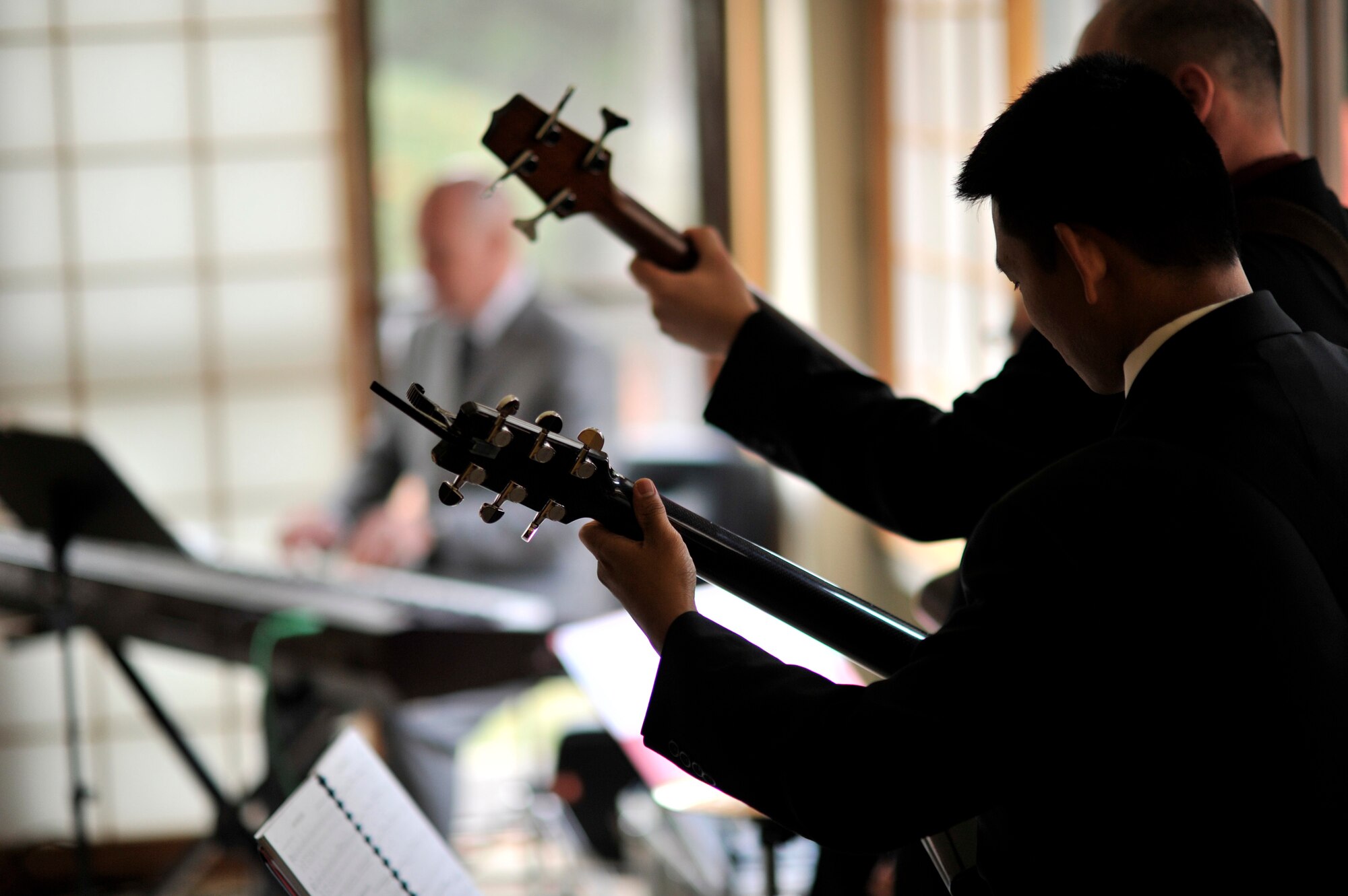 YOKOTA AIR BASE, Japan -- Members of Pacific Trends, a musical combo from the U.S. Air Force Band of the Pacific, Asia, perform at the house of Lt. Gen. Burton Field, U.S. Forces, Japan, and 5th Air Force commander, at Yokota Air Base, Japan, Dec. 3, 2011. Field held a holiday open house with U.S. and Japanese dignitaries to bolster bilateral relations with Japan. (U.S. Air Force photo/Staff Sgt. Samuel Morse)