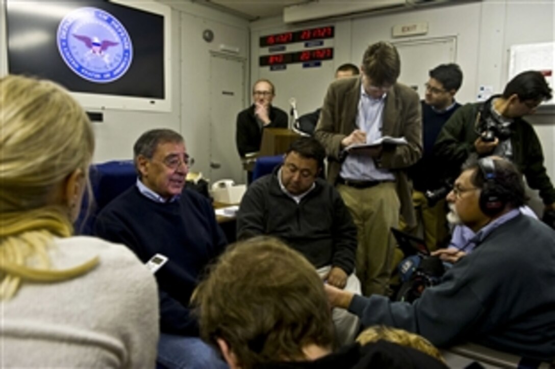 U.S. Defense Secretary Leon E. Panetta briefs the press during a flight to Djibouti, Dec. 12, 2011. While in the country, Panetta plans to meet with Djiboutian leaders and visit U.S. troops stationed there. 