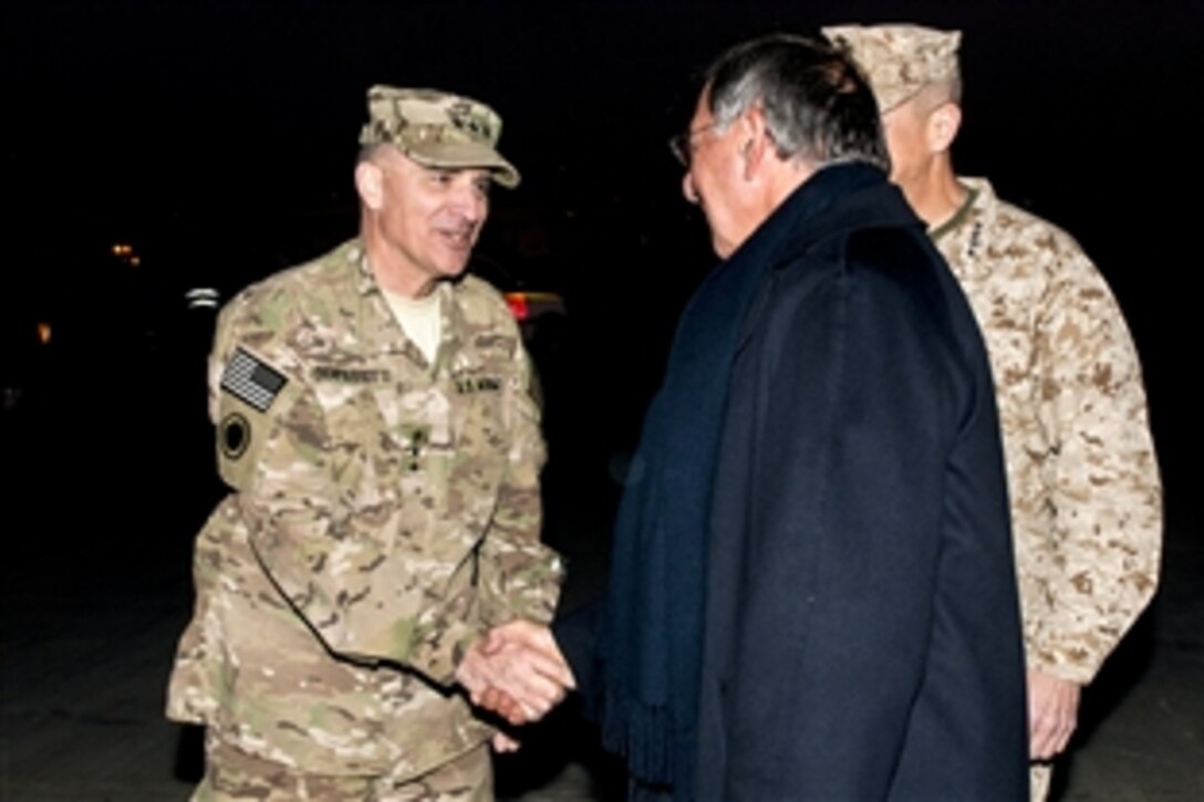 U.S. Army Lt. Gen. Curtis Scaparrotti, commander of the International Security Assistance Force Joint Command and I Corps, greets U.S. Defense Secretary Leon E. Panetta in Kabul, Afghanistan, Dec. 13, 2011. Panetta arrived at Kabul International Airport and is scheduled to visit with Afghan leaders, including the Afghan President Hamid Karzai.