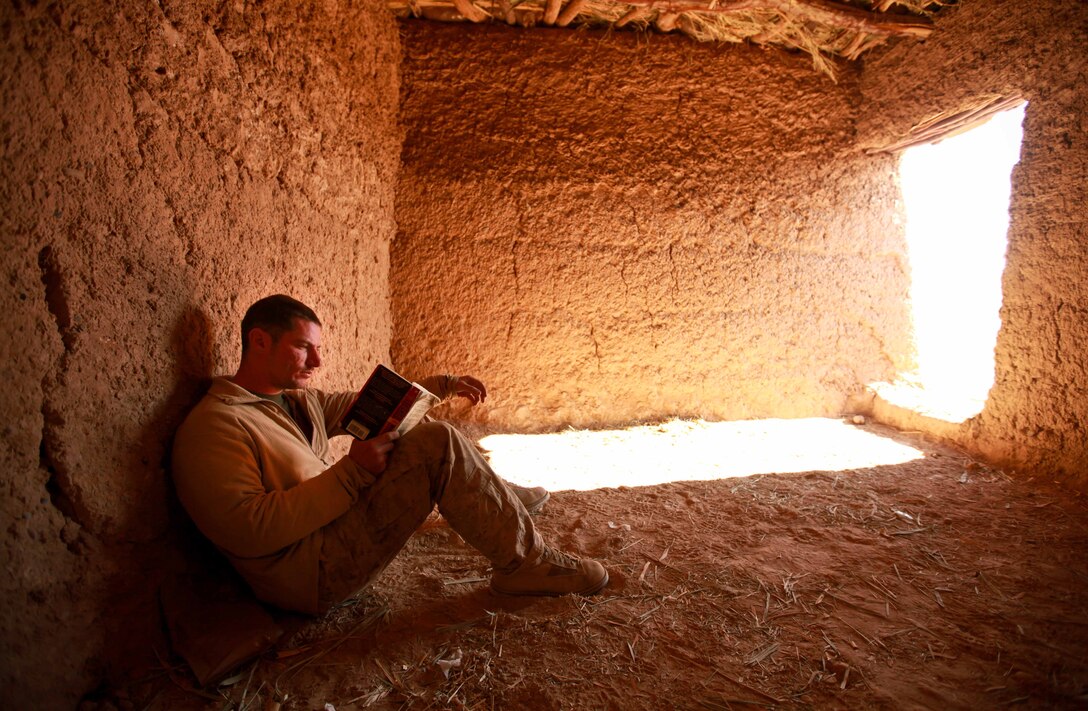 Ocoee, Fla., native Cpl. David Gage relaxes inside a mud hut after a security patrol.  The 2006 Ocoee High School graduate served as an enlisted advisor with Team 1, Border Advisor Team 1, during Operation Eagle Hunt.  Gage shares his knowledge as a military policeman with the Afghan Border Policemen he mentors.