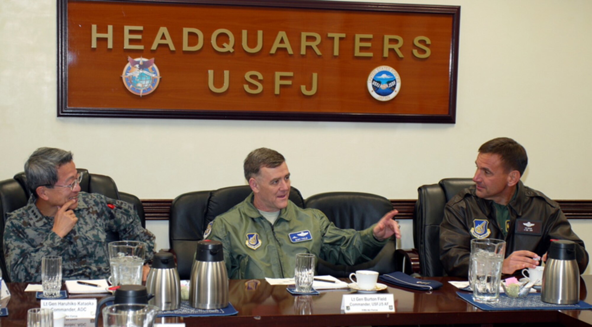YOKOTA AIR BASE, Japan -- Lt. Gen. Burton Field, center, US Forces Japan and 5th Air Force Commander, talks with Japan Air Self-Defense Force Lt. Gen. Haruhiko Kataoka, left, Air Defense Command Commander, and Lt. Gen. Ted Kresge, right, 13th Air Force Commander, during a combined office call at Headquarters USFJ Dec. 14, 2011.  The generals met to discuss the US-Japan military alliance and the upcoming Keen Edge exercise scheduled for January 2012.  (U.S. Army photo/Master Sgt. Frank Bordenave)