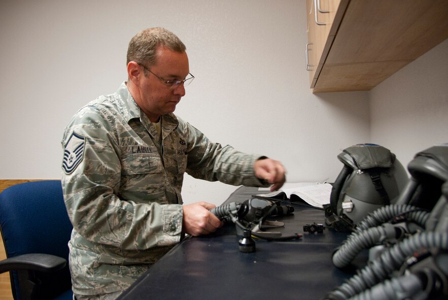 Master Sgt. Don Lauver works on an oxygen mask in the newly-refurbished aircrew flight equipment section in building 44, Dec. 12. The 162nd Operations Group facility at Tucson International Airport is opening back up for business after a much needed $5 million renovation. (U.S. Air Force photo/Master Sgt. Dave Neve)