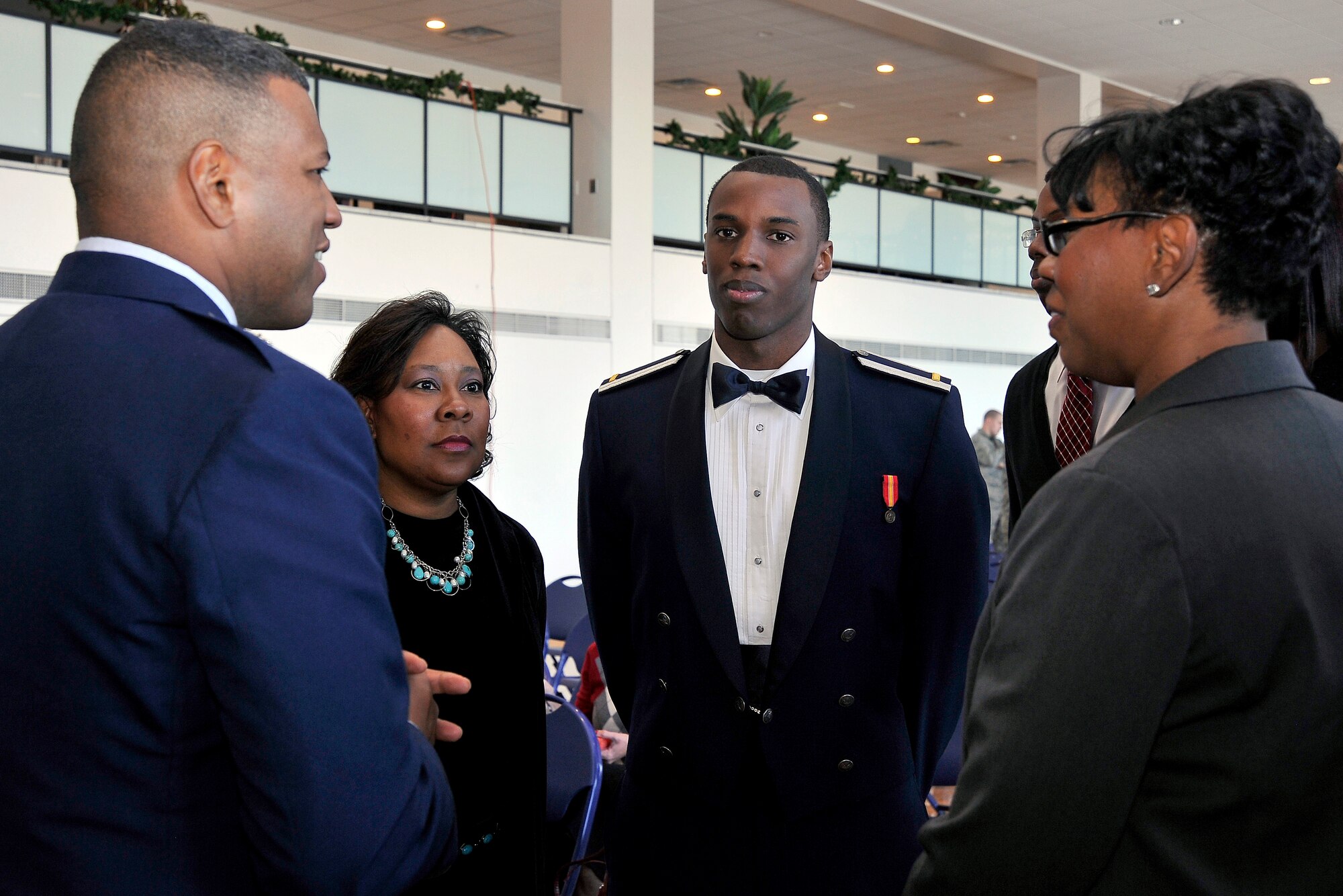 Brig. Gen. Richard Clark, left, speaks with members of newly commissioned 2nd Lt. Braylon Gurnell's family after a graduation ceremony at the Air Force Academy Dec. 14, 2011. Gurnell, a Houston native, was one of four cadets to graduate and earn their commissions, raising the total number of Air Force Academy graduates to 43,915. Clark is the Academy's commandant of cadets. (U.S. Air Force photo/Elizabeth Andrews)