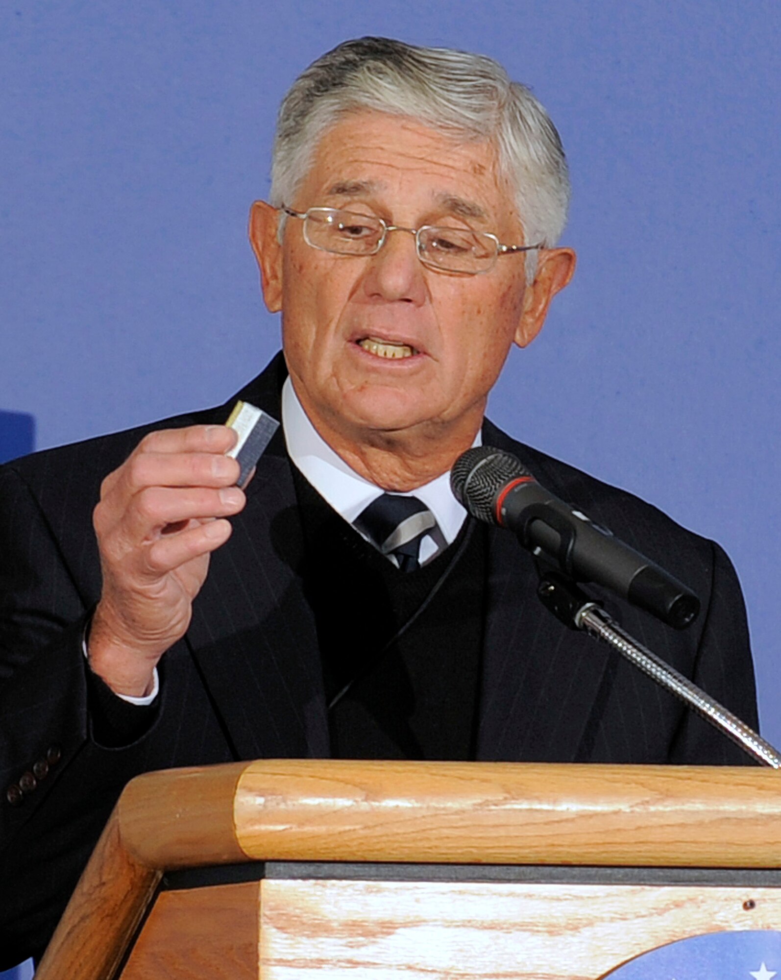 Retired Brig. Gen. Ruben Cubero holds one of the second lieutenant bars presented to graduating cadets from the Class of 1961 during a ceremony at the Air Force Academy Dec. 14, 2011. The Class of '61 is the legacy class for the Class of 2011. Cubero is a former Academy dean of the faculty. (U.S. Air Force photo/Raymond McCoy)