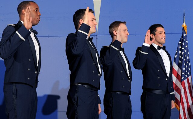 Cadets 1st Class Braylon Gurnell, Patrick Hennessey, Alexander Hess and Kenneth Lamendola swear their oaths of office during a graduation ceremony at the Air Force Academy Dec. 14, 2011. The four are the final additions to the Academy's Class of 2011, which now numbers 1,035. (U.S. Air Force photo/Raymond McCoy)