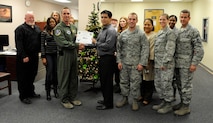 LAUGHLIN AIR FORCE BASE, Texas – Eulalio Trevino, 47th Force Support Squadron information technology manager, poses with Col. Tom Murphy, 47th Flying Training Wing Commander after being presented the XLer of the week award here Nov. 30. The XLer is a weekly award chosen by wing leadership and given to those who consistently make outstanding contributions to Laughlin and their unit. (U.S. Air Force photo/Airman 1st Class Nathan L. Maysonet)
