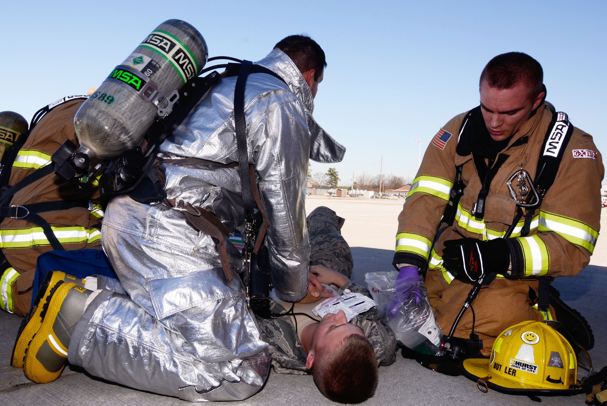 Members of the Dobbins Fire and Rescue Services administer life saving procedures to a simulated victim during a mass casualty exercise held here Dec. 13. (U.S. Air Force photo/Don Peek)