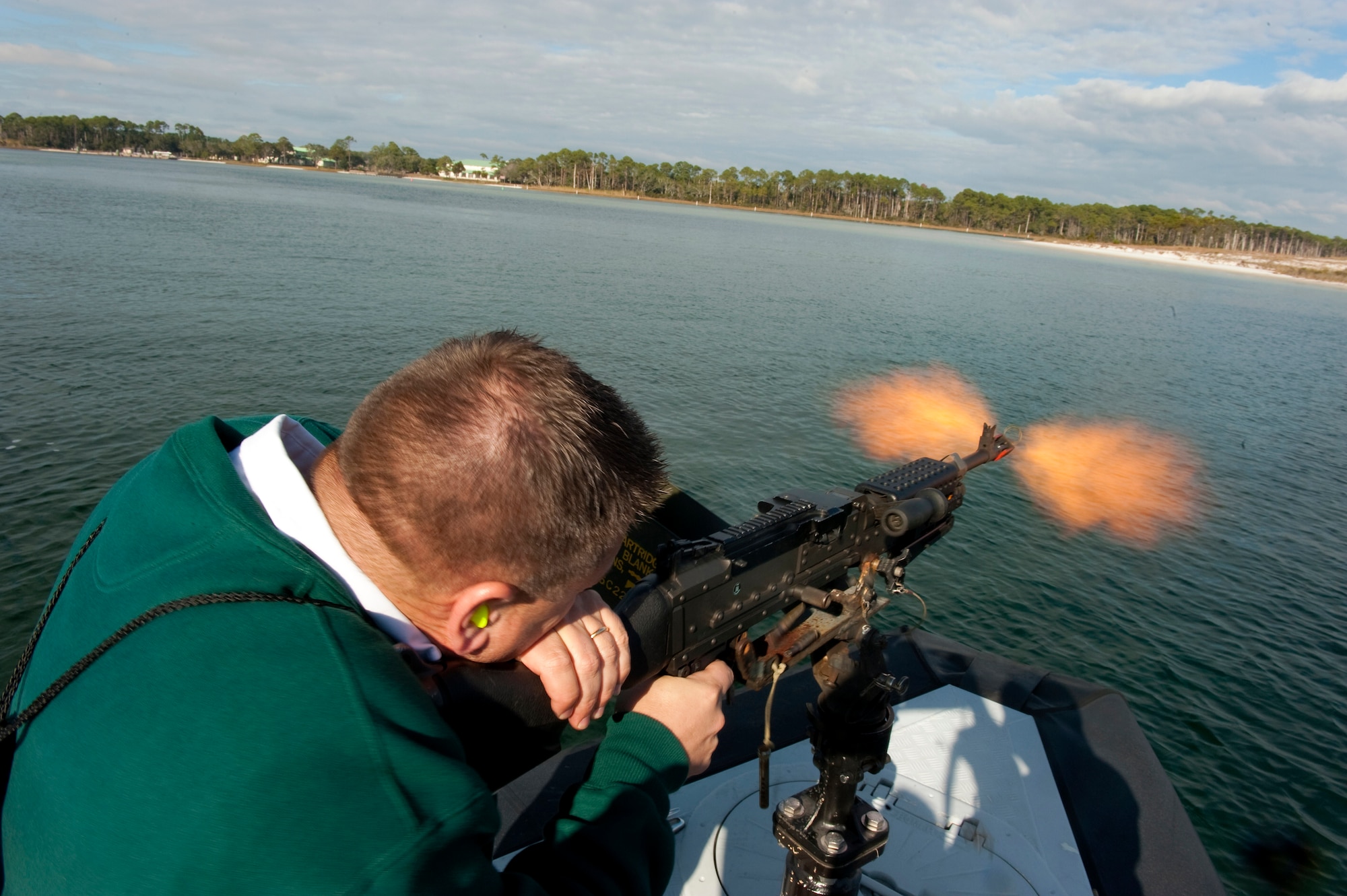 Kenneth LaPee, honorary commander of the 1st Special Operations Mission Support Group, shoots an M-240 machine gun during an honorary commander demonstration on Hurlburt Field, Fla., Dec. 13, 2011. Honorary squadron commanders consist of community leaders from local businesses, law enforcement, professional associations and schools. (U.S. Air Force photo/Airman 1st Class Christopher Williams)(Released) 