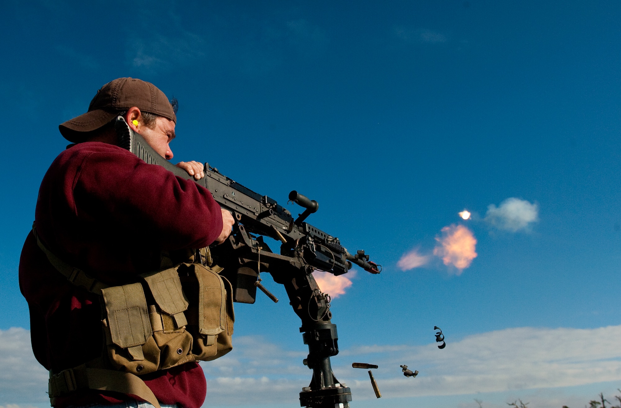Kelly Hughes, 1st Special Operations Support Squadron Range Support flight opposition forces member, demonstrates the fire power of a mounted M-240 machine gun during an honorary commander demonstration on Hurlburt Field, Fla., Dec. 13, 2011. The intent of the Honorary Squadron Commander Program is to encourage an exchange of ideas, experiences and friendship between key members of the local civilian and military communities. (U.S. Air Force photo/Airman 1st Class Christopher Williams)(Released)