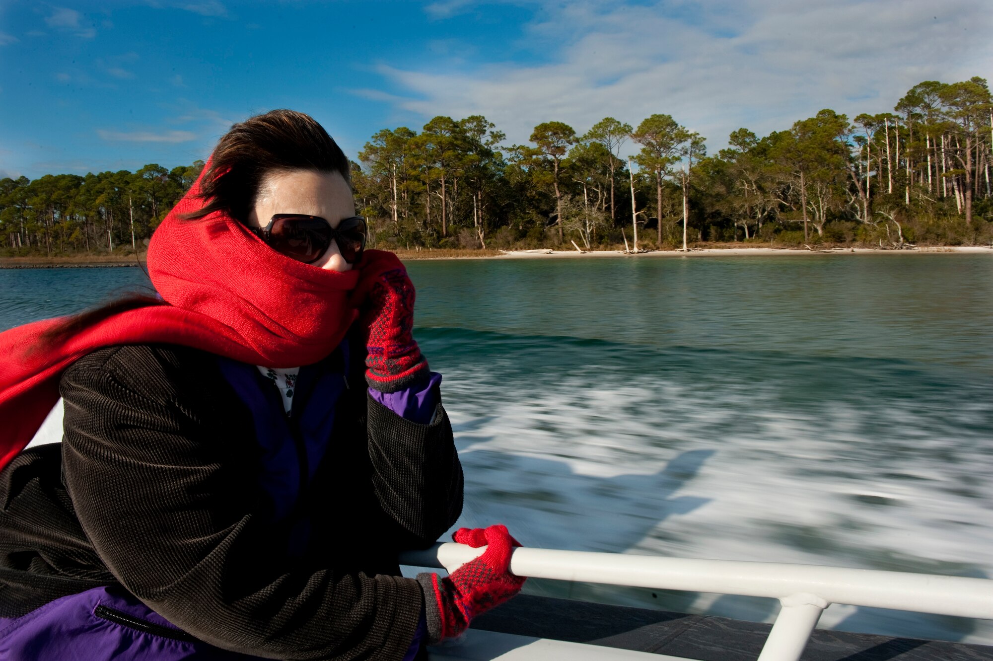 Kelly Murphy-Redd, honorary commander of the 505th Combat Training Squadron, watches as a member of the 1st Special Operations Support Squadron Range Support flight opposition forces, shows off the fire power of an M-240 machine gun during an honorary commander demonstration held on Hurlburt Field, Fla., Dec. 13, 2011. The honorary commanders took part in a tour of the base and demonstrations ranging from computer simulations to Mi-17 Hip rides over the base. (U.S. Air Force photo/Airman 1st Class Christopher Williams)(Released)