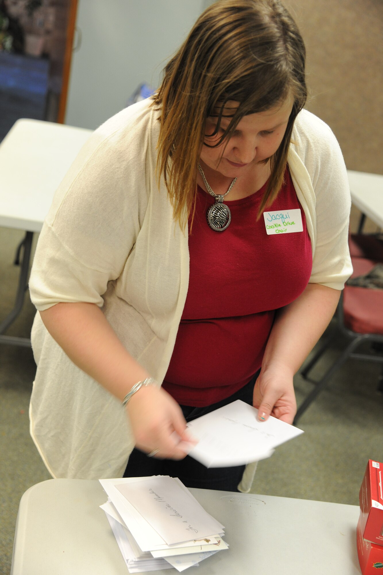 Jacqui Winchell, cookie drive chairman, sorts and counts Christmas cards that will be delivered to Airmen in different squadrons on Moody Air Force Base, Ga., Dec. 13, 2011. Each squadron received enough cards to be sent to every Airman who resides in the dorms. (U.S. Air Force photo by Airman 1st Class Paul Francis/Released)
