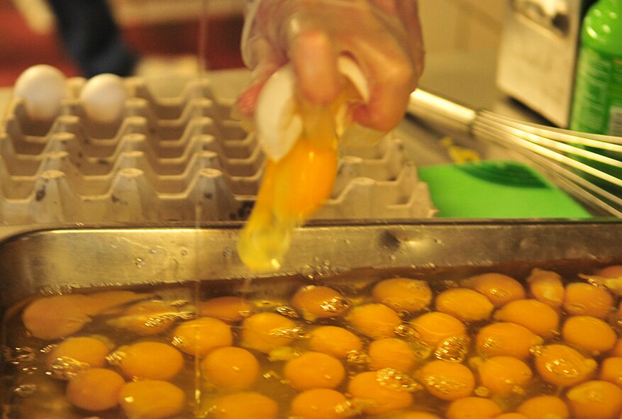 More than 200 eggs were used to feed 450 people during the Chief’s Group Pancake Breakfast at Seymour Johnson Air Force Base, N.C., Dec. 8, 2011. Flapjacks, eggs and sausages were served from 5:30 a.m. to 8 a.m., as part of a fundraiser for events here. The event is the only fundraiser the Chief’s Group holds each year. (U.S. Air Force photo by Senior Airman Marissa Tucker)