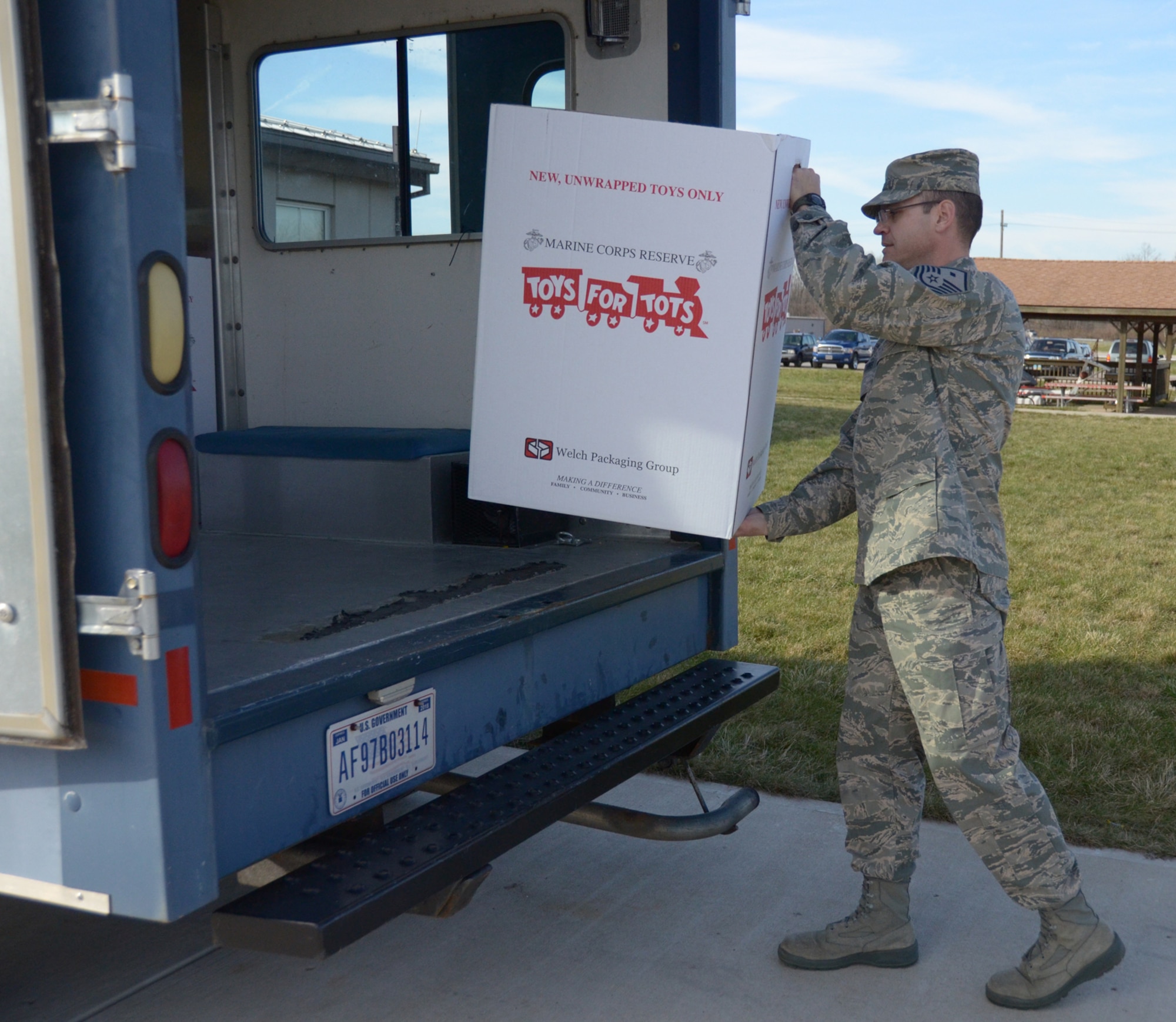 WRIGHT-PATTERSON AIR FORCE BASE, Ohio - Master Sgt. Anthony Johns, 445th Operations Support Squadron first sergeant, loads boxes of toys donated by 445th Airlift Wing members onto a truck during the last day of the Toys for Tots program Dec. 12. The wing collected 642 toys weighing 259 pounds. (U.S. Air Force photo/Stacy Vaughn)
