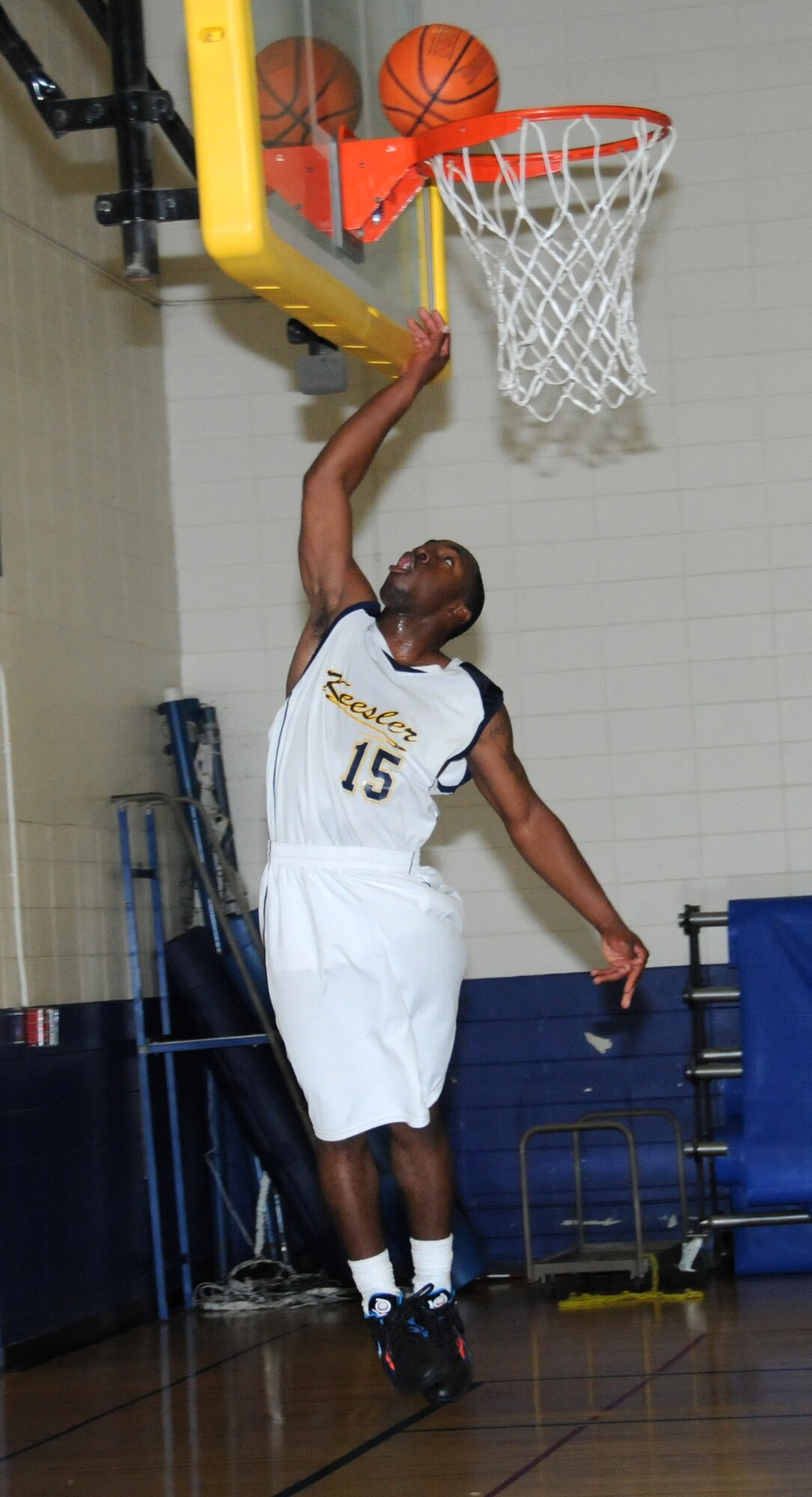 Keesler Dragon, Quameir Harding, makes a layup during a varsity basketball game against the Hulrburt Field Commandos, Dec. 10, 2011, at the Blake Fitness Center, Keesler Air Force Base, Miss.  Harding tallied 17 points in the second half and led all scorers at the final buzzer with 26 points. His teammate, Mario McKnight, was Keesler’s top scorer in the first half with 13 points.The Keesler Dragons defeated the Hurlburt Field Commandos, 73-62.  (U.S. Air Force photo by Kemberly Groue)
