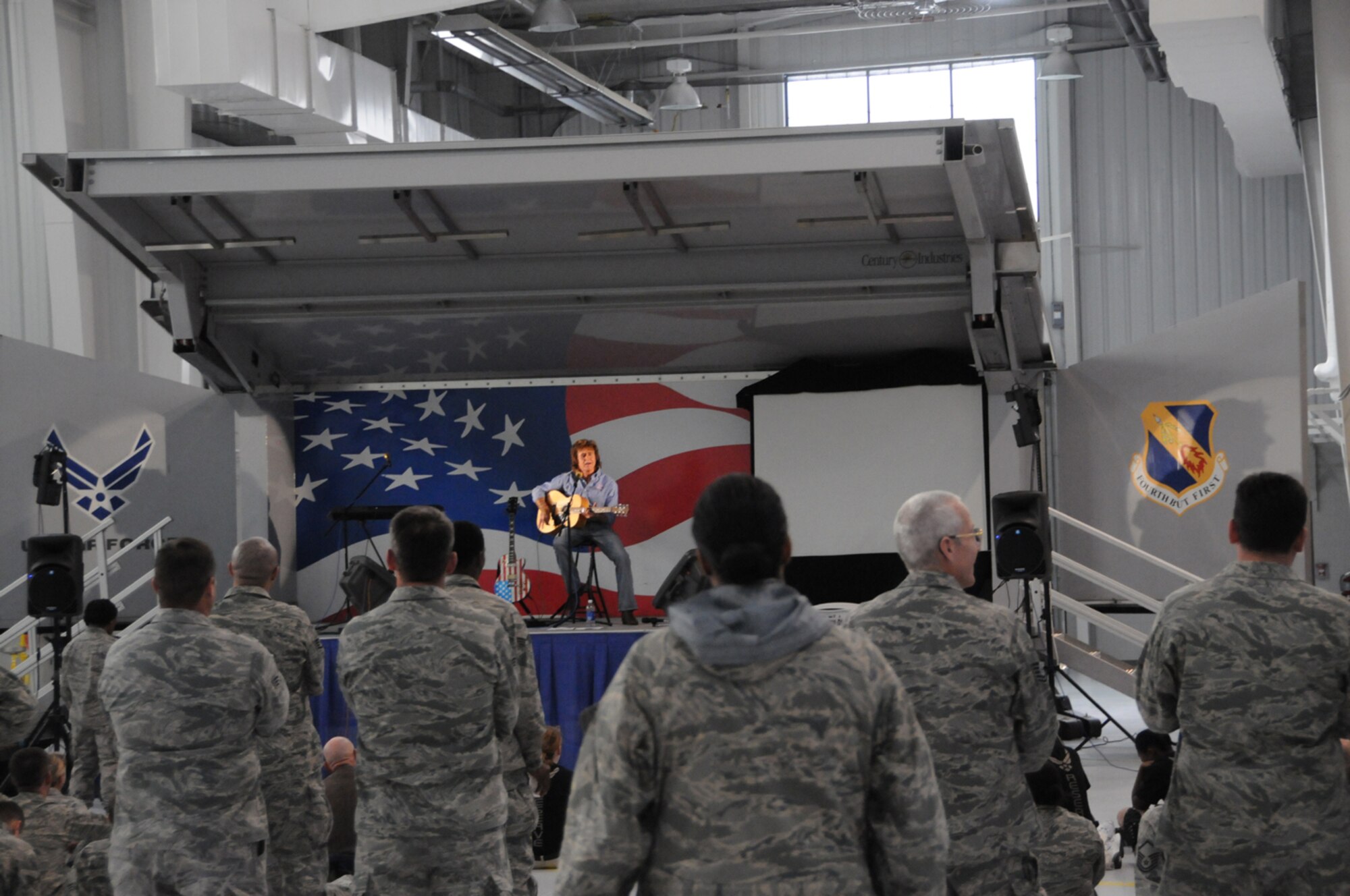 Singer/songwriter John Parr gave a concert to the men and women of the 916th Air Refueling Wing on Dec. 11 here. He included popular songs he wrote in the 80s, but also new songs we wrote specifically for America's armed forces. (USAF photo by Tech. Sgt. Scotty Sweatt, 916ARW/PA) 


