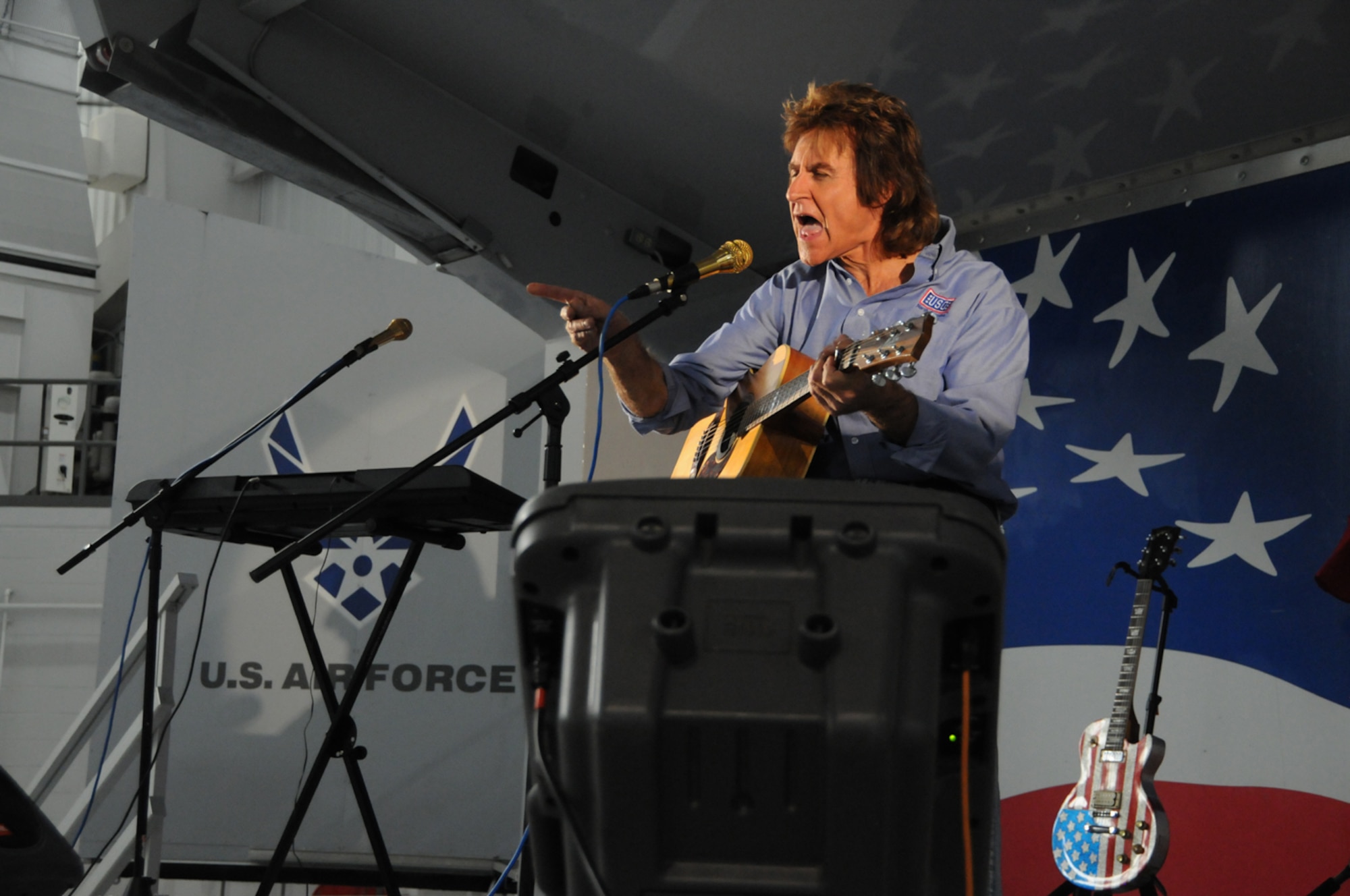 Singer/songwriter John Parr gave a concert to the men and women of the 916th Air Refueling Wing on Dec. 11 here. He included popular songs he wrote in the 80s, but also new songs we wrote specifically for America's armed forces. (USAF photo by Tech. Sgt. Scotty Sweatt, 916ARW/PA)