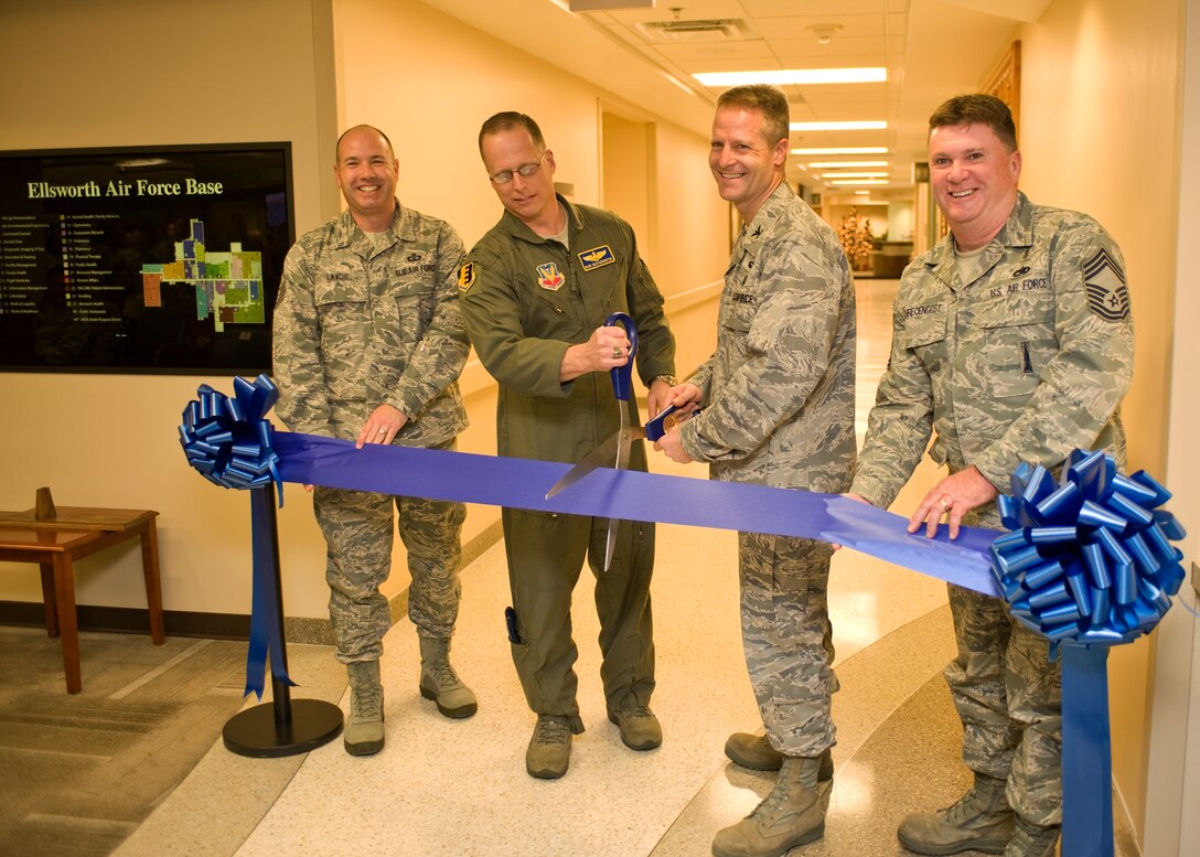 Col. Mark Weatherington, 28th Bomb Wing commander, and Col. Robert Ritter, 28th Medical Group commander, cut the ribbon officially opening  the newly renovated 28th Medical Group facility on Ellsworth Air Force Base, S.D., Dec. 9, 2011.  The 15 month long renovation project efficiently consolidated space resulting in financial savings.  (U.S. Air Force photo by Airman 1st Class Anania Tekurio/released)