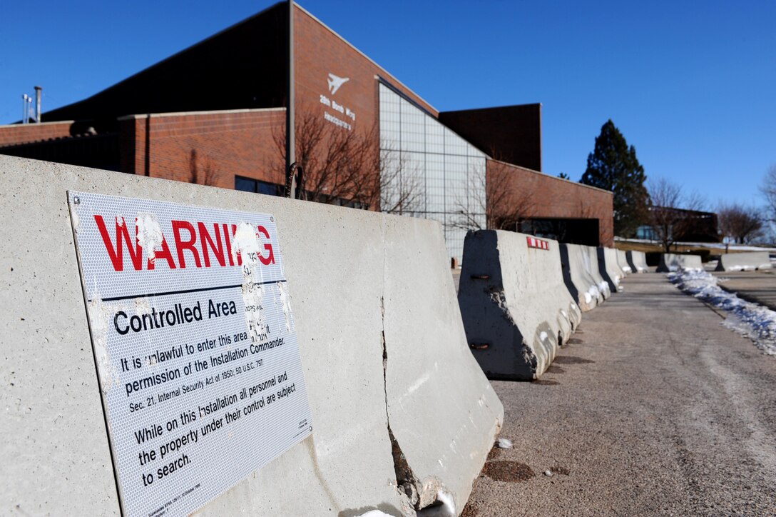 Concrete barriers surround the 28th Bomb Wing Headquarters building during heighted security measures for the Operational Readiness Exercise on Ellsworth Air Force Base, S.D., Dec. 6, 2011. The exercise tests Airmen’s response, readiness and ability to operate in a wartime environment. (U.S. Air Force Photo by Airman 1st Class Zachary Hada/Released)