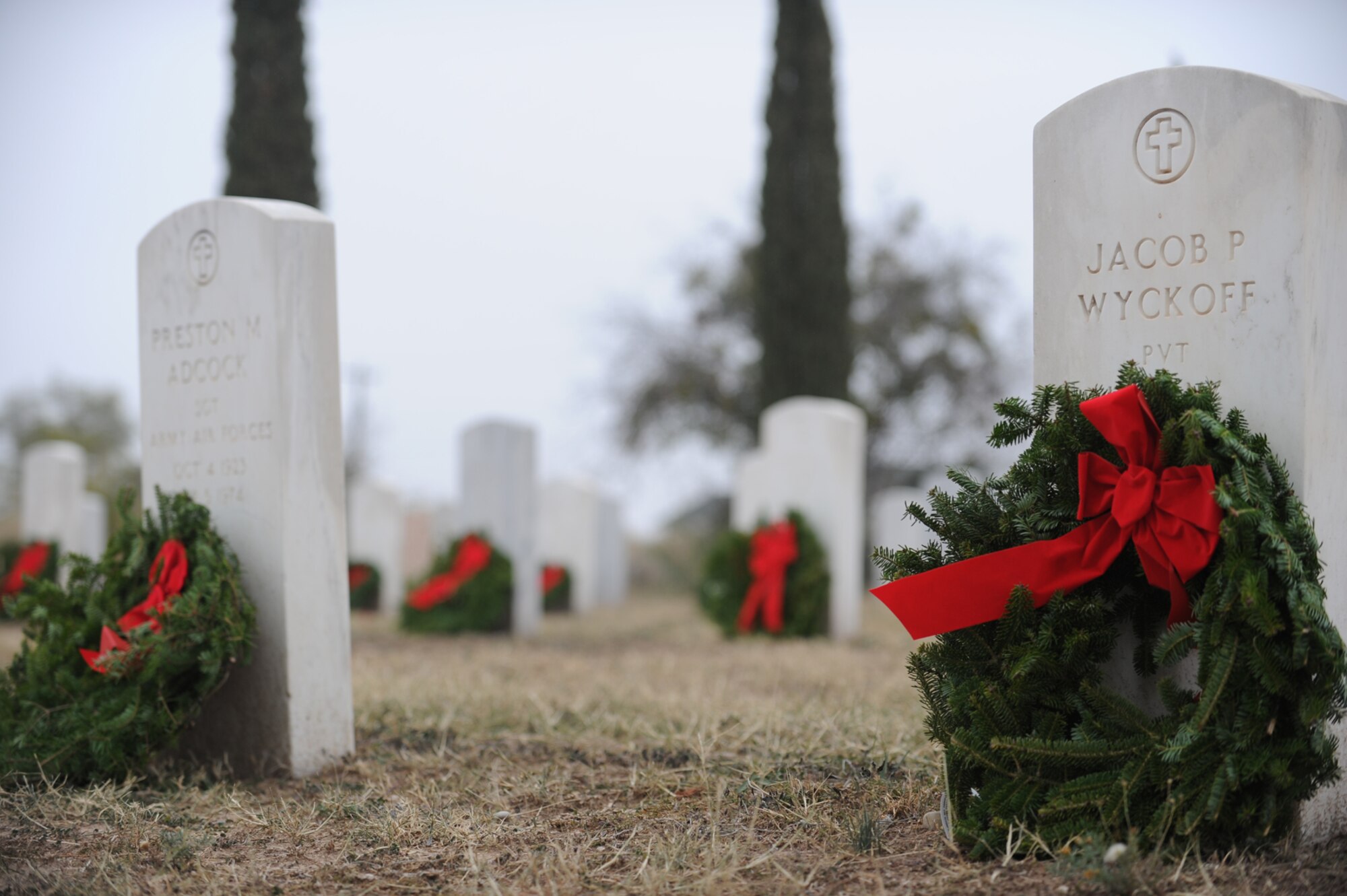 SAN ANGELO, Texas -- Graves of veterans of current conflicts and past wars are decorated with wreaths in recognition of their sacrifices during the Civil Air Patrol's annual Wreaths Across America event at Belvedere Memorial Park, Dec. 10. The tradition of the wreath laying ceremony began at Arlington National Cemetery in 1992 and has grown to more than 600 locations across the nation. (U.S. Air Force photo/Staff Sgt. Laura R. McFarlane)