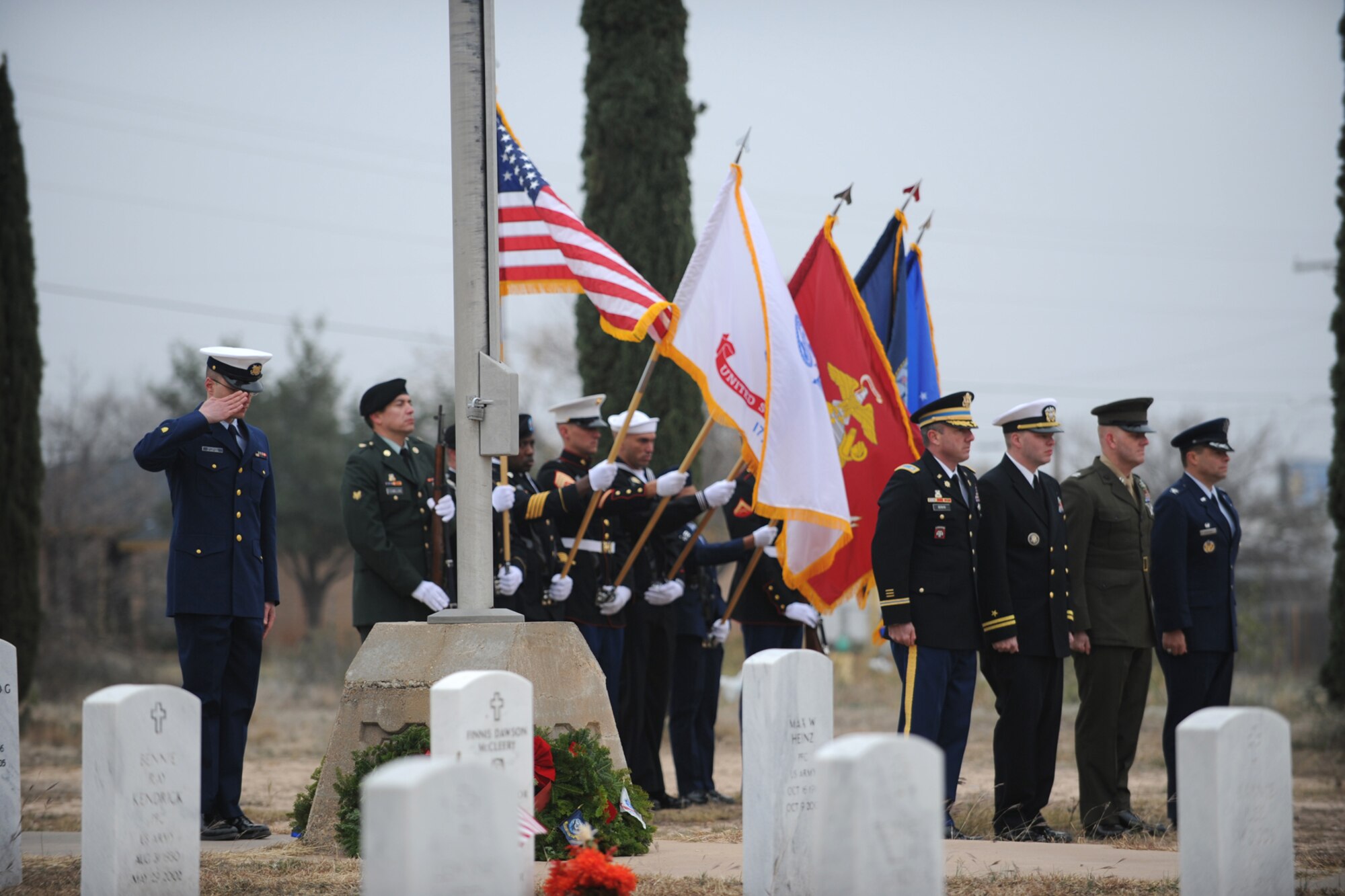 SAN ANGELO, Texas -- A U.S. Coastguardsman from Goodfellow Air Force Base, renders a salute after placing a wreath representing the U.S. Coast Guard during the Civil Air Patrol's annual Wreaths Across America event at Belvedere Memorial Park Cemetery Dec. 10. Veterans are honored in more than 600 locations across the nation and in 24 national cemeteries located on foreign soil with a ceremony and with the placing of wreaths on their graves. (U.S. Air Force photo/Staff Sgt. Laura R. McFarlane)