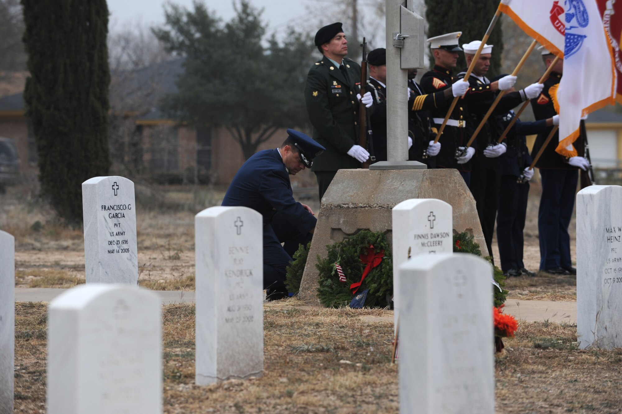 SAN ANGELO, Texas -- Col. Mark Damiano, 17th Training Wing Commander, places a wreath representing the U.S. Air Force during the Civil Air Patrol's annual Wreaths Across America event at Belvedere Memorial Park Cemetery Dec. 10. Wreaths Across America is a national program that honors America’s deceased veterans during the holiday season by placing wreaths at their graves. (U.S. Air Force photo/Staff Sgt. Laura R. McFarlane) 