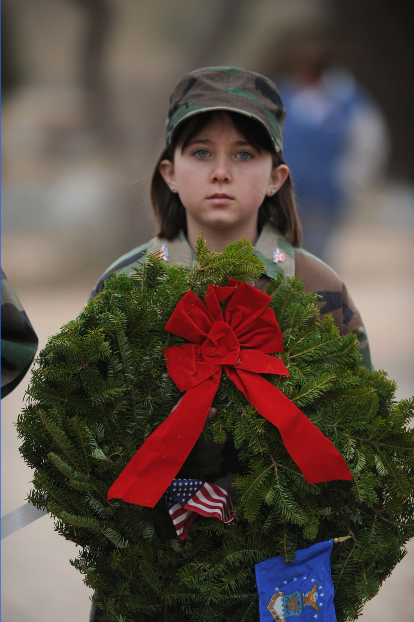 SAN ANGELO, Texas -- Civil Air Patrol cadet Kara Stevens bears a wreath representing the U.S. Air Force during the Civil Air Patrol's annual Wreaths Across America event at Belvedere Memorial Park Cemetery Dec. 10. Wreaths Across America is a national program that honors America’s deceased veterans during the holiday season by placing wreaths at their graves. (U.S. Air Force photo/Staff Sgt. Laura R. McFarlane)