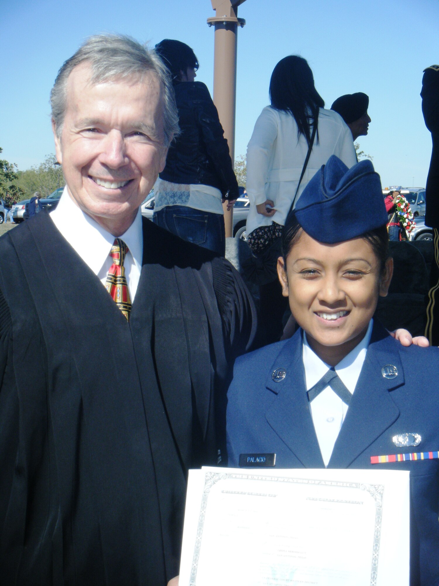 FORT SAM HOUSTON, Texas – Airman 1st Class Leona Palacio, 47th Comptroller Squadron, stands with Judge John Primomo, U.S. Magistrate judge, after earning her citizenship here Nov. 11. (Contributed)