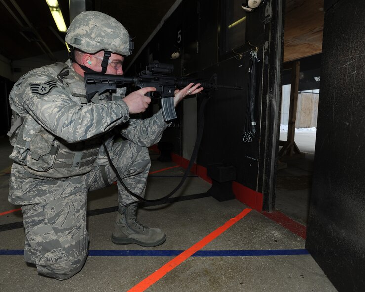 MINOT AIR FORCE BASE, N.D. -- Staff Sgt. Joseph Haller, 5th Security Forces Squadron combat arms training and maintenance instructor, looks down the sight of his M-4 rifle at the shooting range here Dec. 7. Haller was recently awarded the Airman’s Medal for the heroic and selfless act he performed back in the fall of 2008. (U.S. Air Force photo/Airman 1st Class Stephanie Ashley)