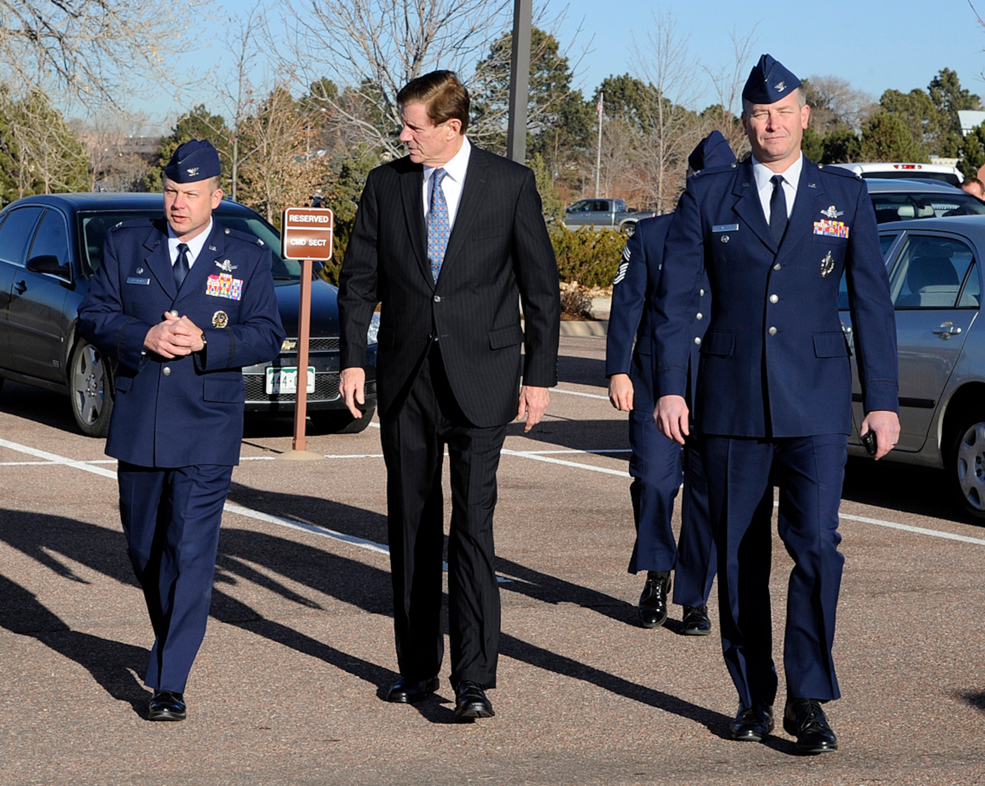 PETERSON AIR FORCE BASE, Colo. – Colorado Spring’s mayor, Steve Bach, (center), is greeted by Col. Chris Crawford (left), 21st Space Wing commander, and Col. Jeffrey Flewelling (right), 21st SW vice commander, Dec. 13, 2011, in front of the wing headquarters building. This was Bach’s first visit to the wing since being elected under a new Colorado Spring’s mayoral system May 17, granting wider executive powers and administrative authority. During his visit, Bach learned more about the 21st SW’s global missile warning and space control missions, future growth plans and the wing’s mutual aid agreement as first responders to fires and emergencies at the city airport. (U.S. Air Force photo/Rob Bussard)