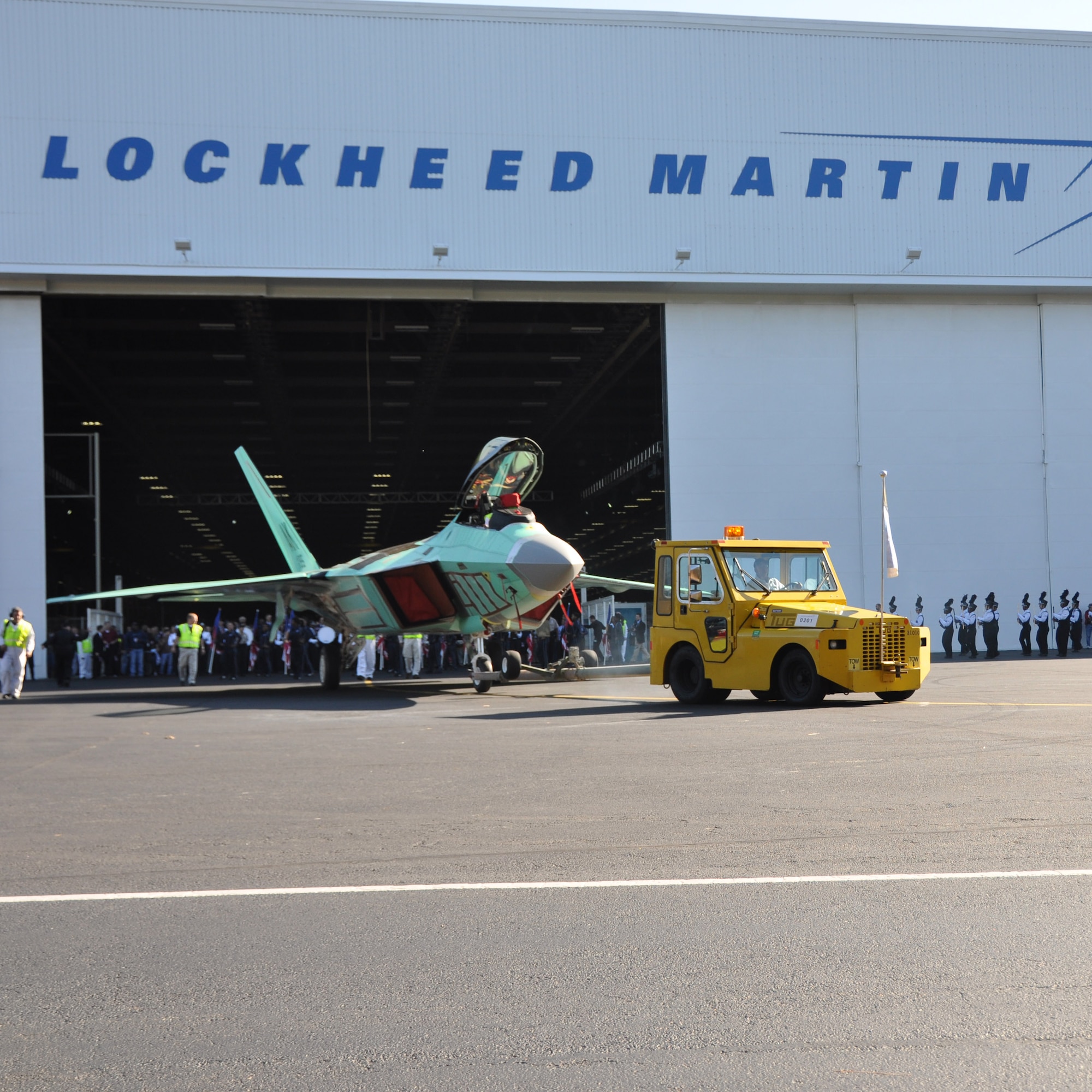 The final F-22 Raptor fighter jet is  rolled off the Lockheed Martin assembly line at a ceremony at the Marietta, Ga. plant Dec. 13.  The jet is the last of 187 F-22s produced for the Air Force completing its operational fleet. (U.S. Air Force photo/ Senior Airman Danielle Purnell)