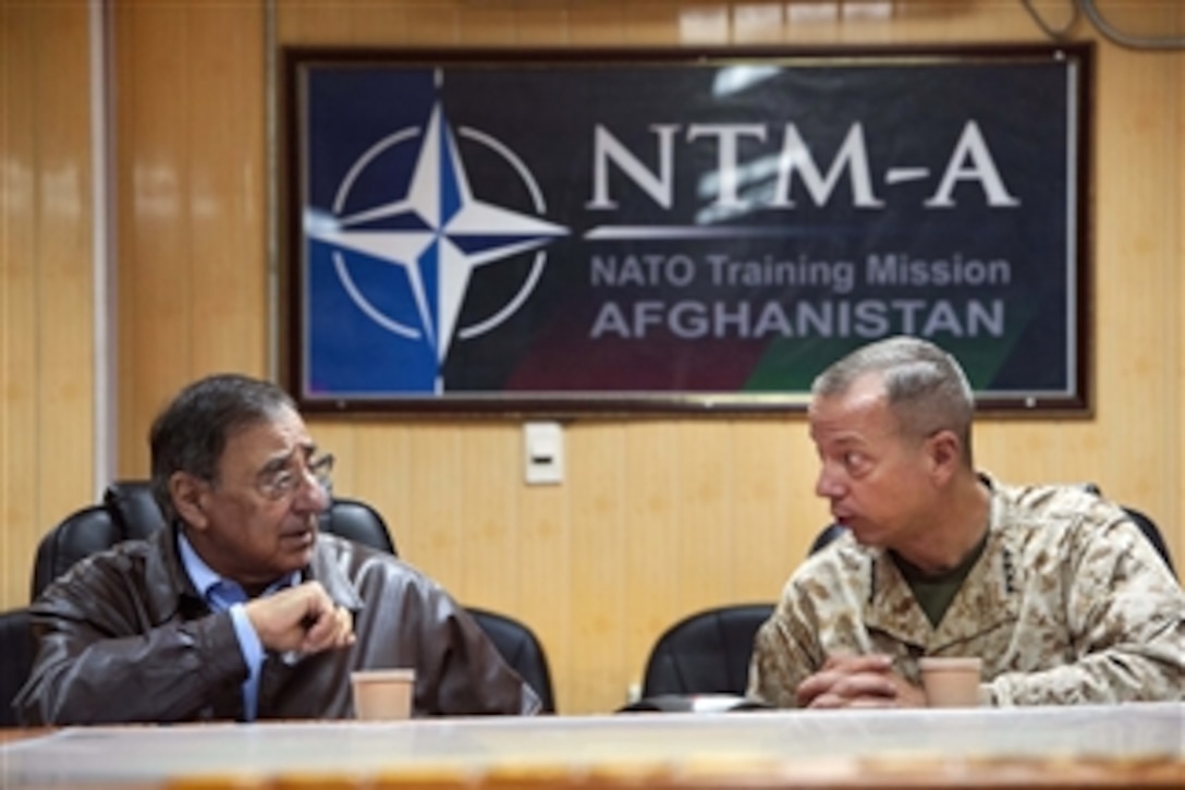 Secretary of Defense Leon E. Panetta listens as Commander of U.S. and International Forces in Afghanistan Gen. John R. Allen, U.S. Marine Corps, speaks during a meeting in Kabul, Afghanistan, on Dec. 13, 2011.  