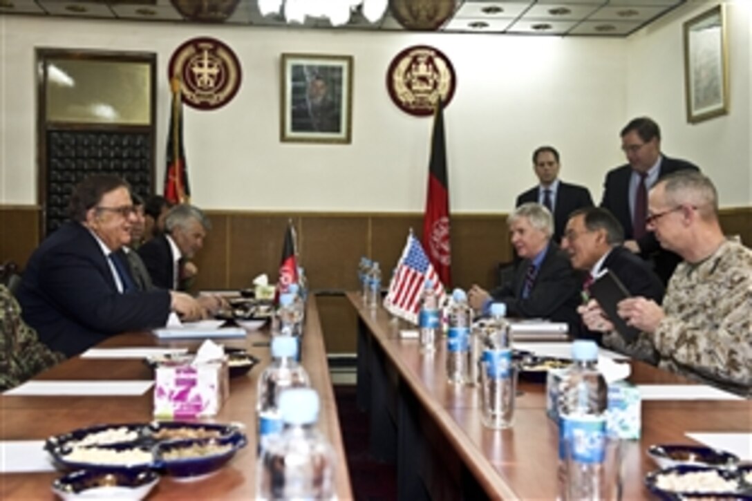 U.S. Defense Secretary Leon E. Panetta, center right, meets with Afghan Defense Minister Gen. Abdul Rahim Wardak, left, in Kabul, Afghanistan, Dec. 14, 2011. During the meeting, Panetta said the United States was committed to help Afghanistan progress as a country.