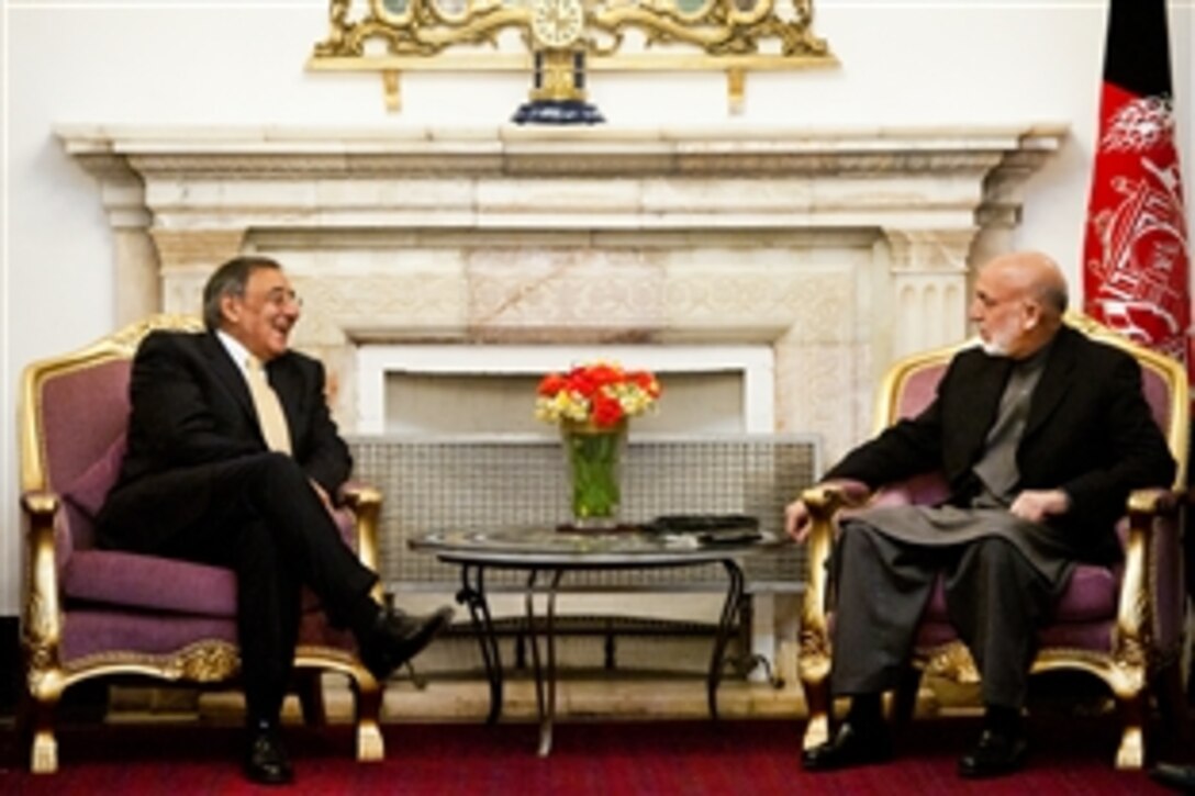 U.S. Defense Secretary Leon E. Panetta meets with Afghan President Hamid Karzai in Kabul, Afghanistan, Dec. 14, 2011. Panetta said the United States was committed to working with the Afghan government to promote a free and independent country.