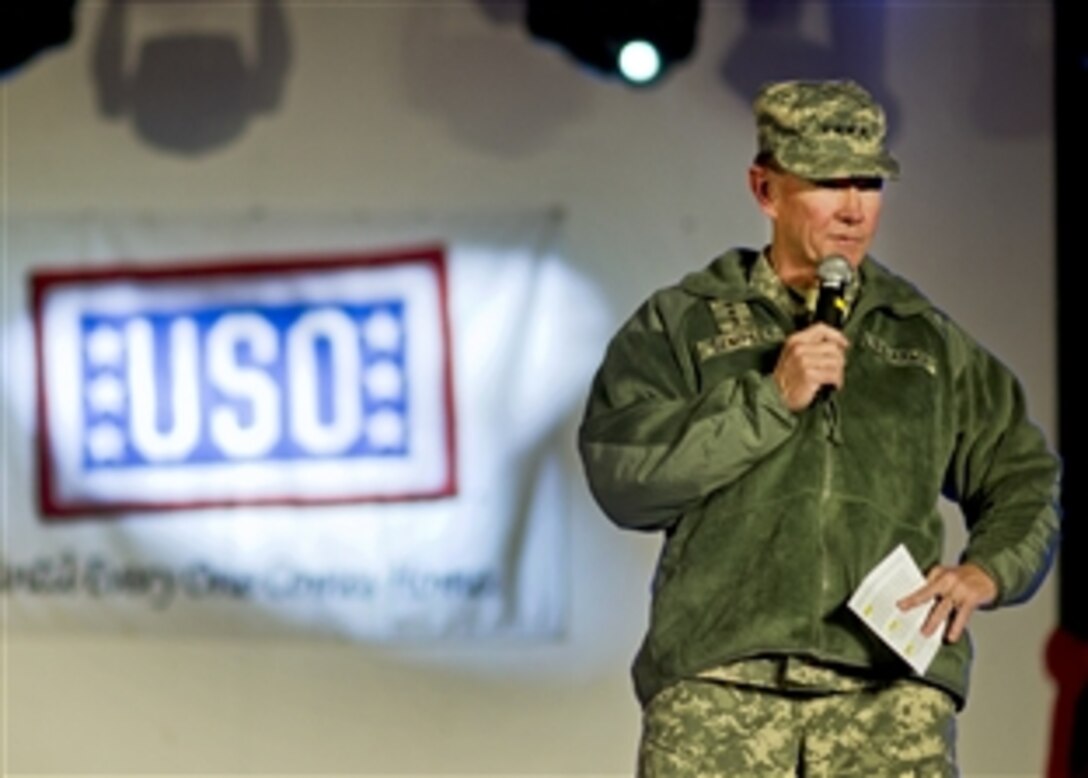 U.S. Army Gen. Martin E. Dempsey, chairman of the Joint Chiefs of Staff, talks to the audience at the USO show on Camp Buehring, Kuwait, Dec. 14, 2011.