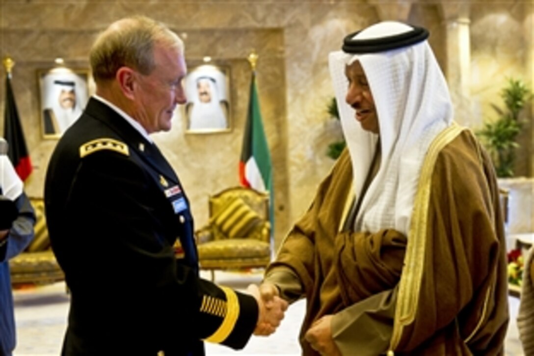 Kuwaiti Prime Minister Jabir al-Mubarak al-Hamad al-Sabah greets U.S. Army Gen. Martin E. Dempsey, chairman of the Joint Chiefs of Staff, for a meeting in Kuwait City, Dec. 14,  2011.