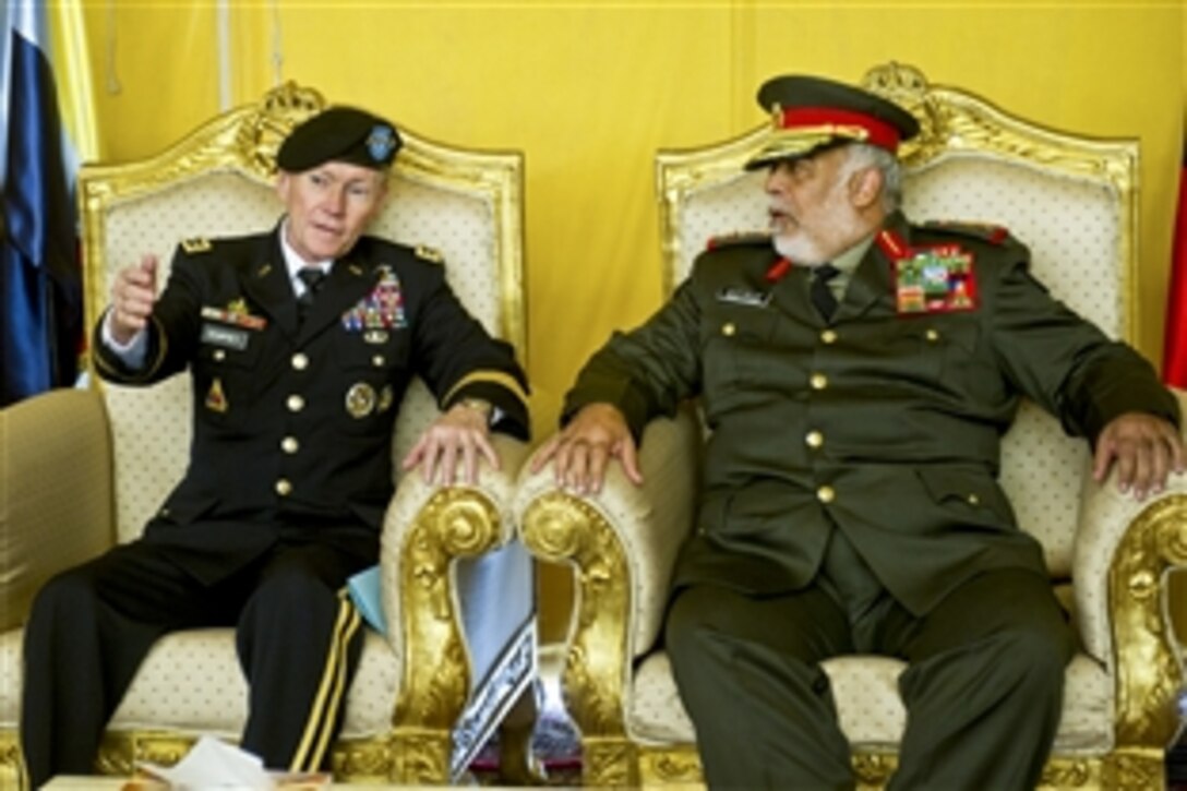 U.S. Army Gen. Martin E. Dempsey, chairman of the Joint Chiefs of Staff, talks Kuwaiti Lt Gen Ahmed Al Sabah in Kuwait City, Dec. 14,  2011.