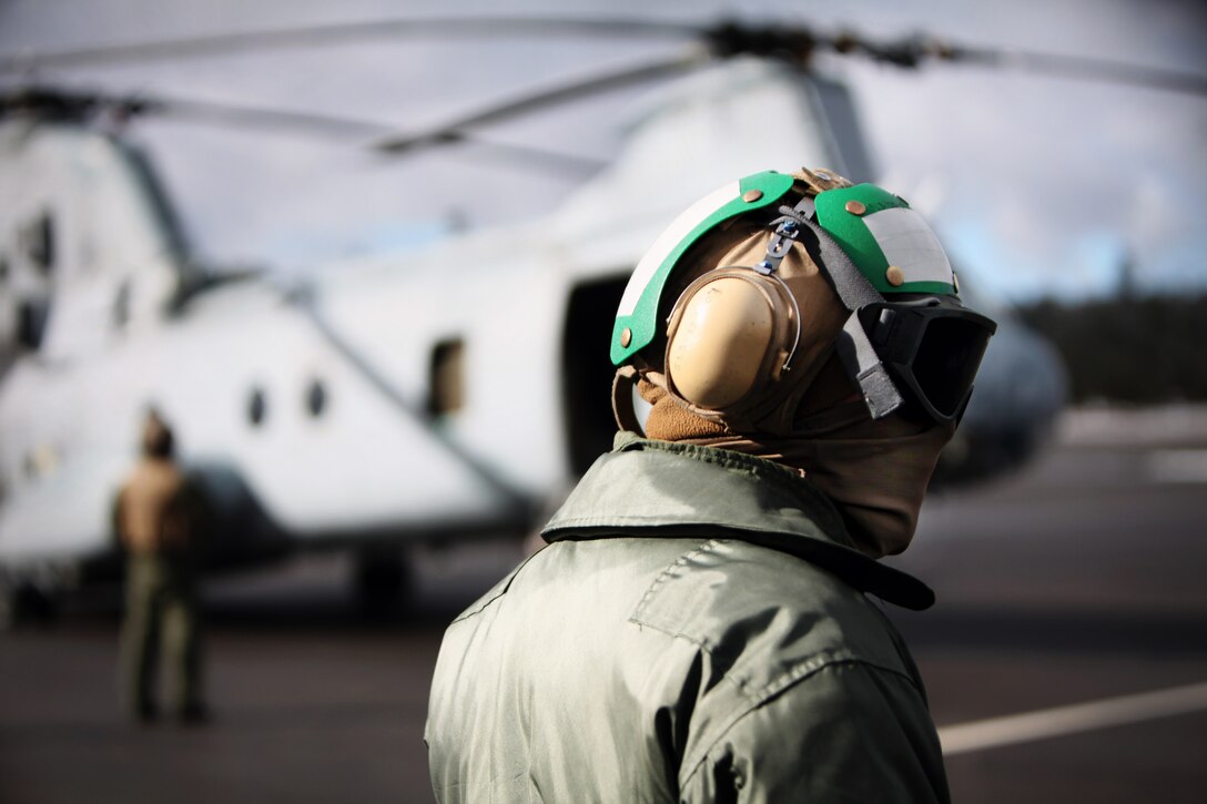 Cpl. Terrance Green, air-frames mechanic, Marine Medium Helicopter Squadron 764, Marine Aircraft Group 41, 4th Marine Aircraft Wing, waits for the other CH-46E Sea Knight helicopters to arrive Dec. 14 as part of Operation Havasupai. The operation was a Marine Corps Reserve and Toys for Tots collaboration in which five airdrops consisting of toys and supplies were delivered to the people of the remote Supai Village, Ariz., deep within the Grand Canyon. (Photo by Lance Cpl. Marcin Platek)