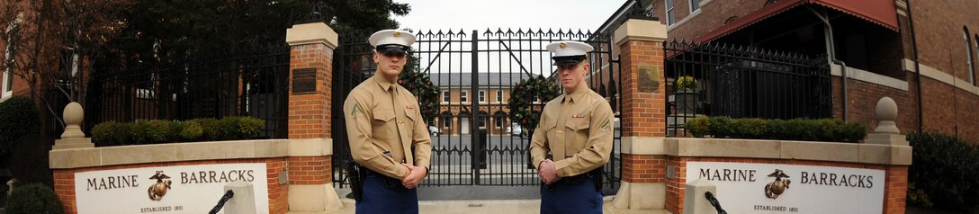 Lance Cpl. James Gigliello, left, and Lance Cpl. Shawn Brown stand in front of the entrance to Marine Barracks Washington, the "Oldest Post of the Corps." Gigliello, 23, hails from Boston, while Brown, 24, hails for Haggerstown, Md.
