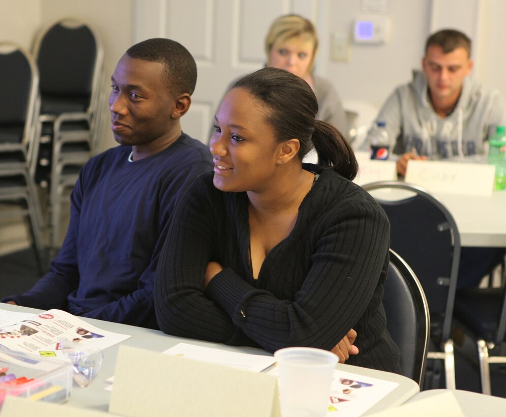 A couple talks to another couple during Marine Corps Community Service’s Marine Corps Family Team Building Marriage Enrichment Workshop at Midway Park, a Marine Corps Base Camp Lejeune housing area, Dec. 16. It is a Prevention and Relationship Enhancement Program workshop.