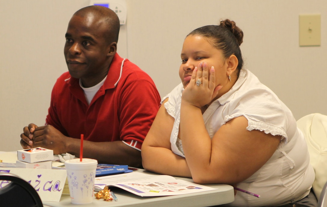 Sgt. Willie PruDe, a collection analyst with II Marine Headquarters Group, and his wife listen to the instructors during Marine Corps Community Service’s Marine Corps Family Team Building Marriage Enrichment Workshop at Midway Park, a Marine Corps Base Camp Lejeune housing area, Dec. 16. The workshops are based on 30 years of research from institutions such as the University of Denver on marriages and relationships.