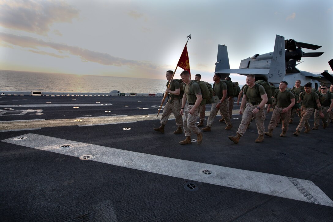 Staff Sgt. Garival Perez assigned to Marine Corps Detachment (MARDET) embarked aboard High Speed Vessel (HSV 2) Swift assists an El Salvadoran Marine adjust his firing technique during weapons training. The two Marines Corps are conducting a three-week training partnership as part of HSV-Southern Partnership Station 2012 (HSV-SPS 12). HSV-SPS 12 is an annual deployment of U.S. ships to the U.S. Southern Command area of responsibility in the Caribbean, Central and South America.