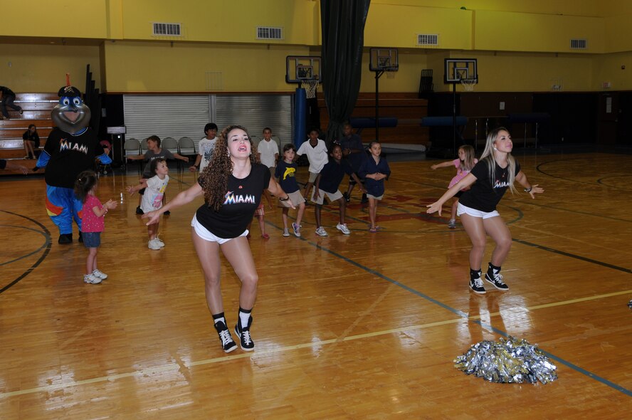 ANDERSEN AIR FORCE BASE, Guam- The Miami Mermaids of the Miami Marlins Major League Baseball team, held a dance clinic for Team Andersen youth and the Youth Center, Dec. 9. The Mermaids taught the children a full dance routine and signed autographs and took pictures. (U.S. Air Force photo/Senior Airman Carlin Leslie)