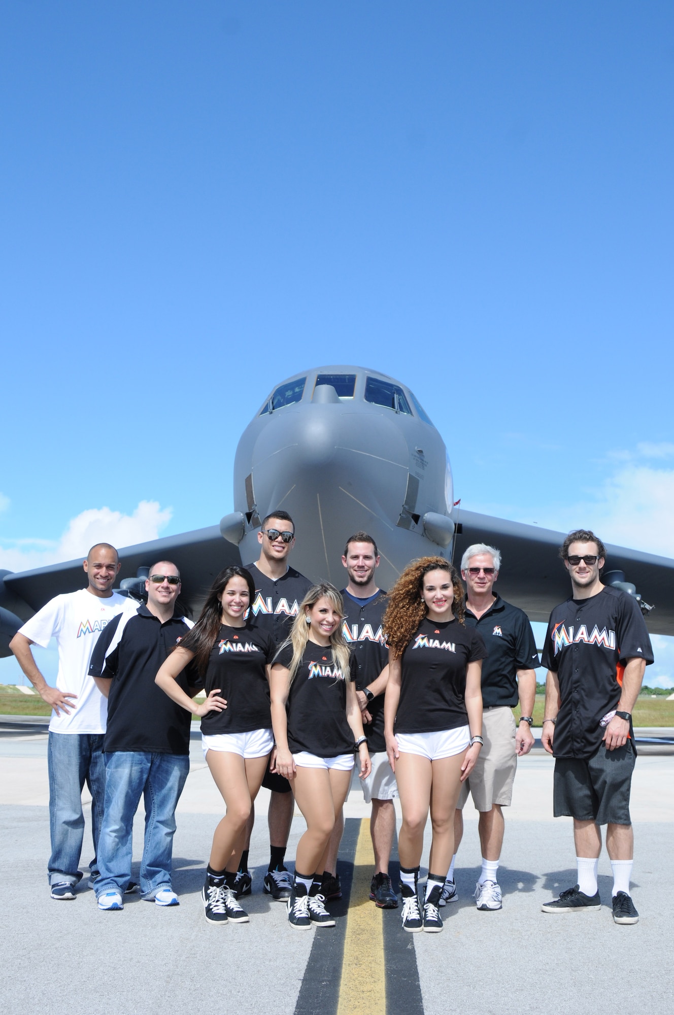 ANDERSEN AIR FORCE BASE, Guam- Team members of the Miami Marlin Major League Baseball team pose in front of a B-52 Stratofortress “The Buff” during their visit to Team Andersen, Dec. 9. The tour is part of the Visit Our Troops 2011 and they also visited with troops in Hawaii and Japan. (U.S. Air Force photo/Senior Airman Carlin Leslie)