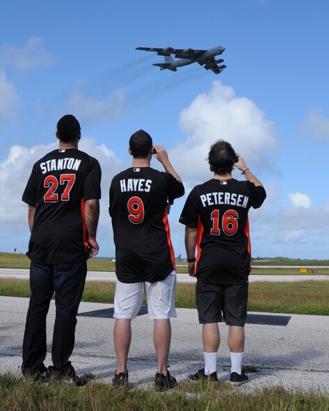 ANDERSEN AIR FORCE BASE, Guam- Mike Stanton, Bryan Peterson and Brett Hayes of the Miami Marlins gaze at the B-52 “The Buff” take off, Dec. 9. During the Miami Marlins visit they toured multiple aircraft and base facilities showing their appreciation to the troops. (U.S. Air Force photo/Senior Airman Carlin Leslie)