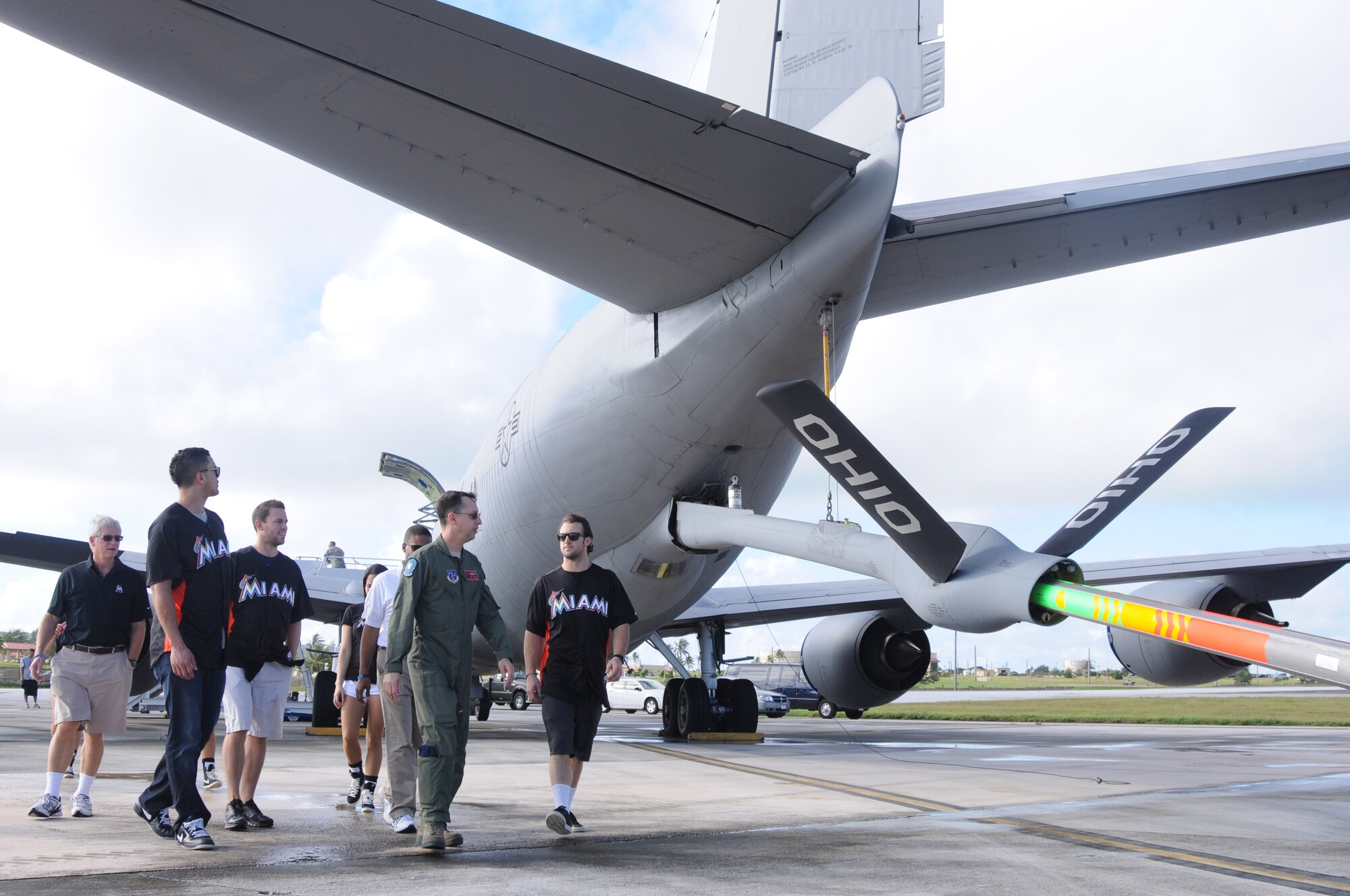 ANDERSEN AIR FORCE BASE, Guam- Team members of the Miami Marlins receive a tour from Senior Master Sgt. Dan Toskin, 121st Air Refueling Wing boom operator, during their visit to Team Andersen, Dec. 9. The tour is part of the Visit Our Troops 2011 and they also visited with troops in Hawaii and Japan. (U.S. Air Force photo/Senior Airman Carlin Leslie)