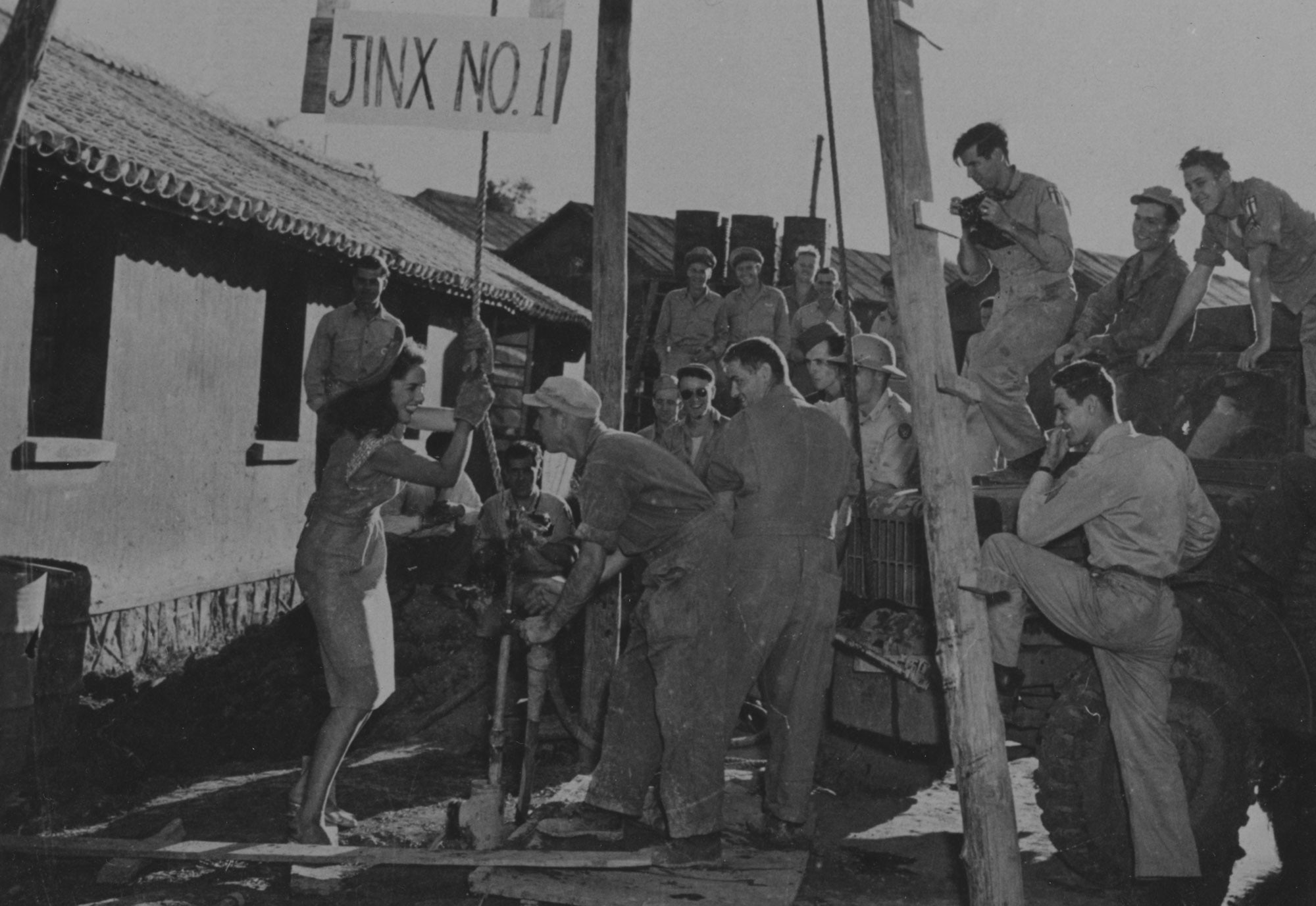 Squadron members happily receive help from Jinx on facility improvements in China during her USO tour to the CBI in late 1944.