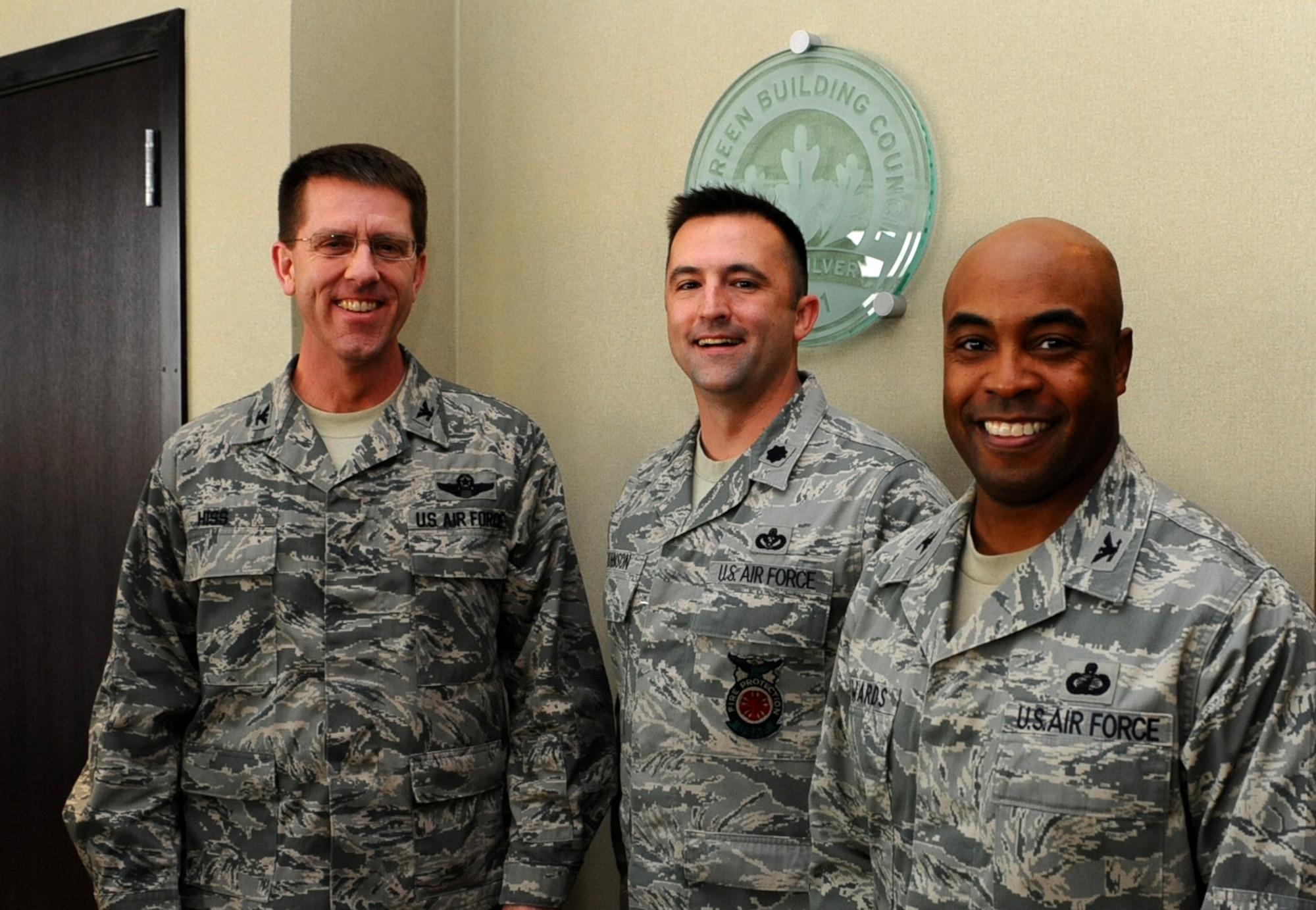 Col. Steven Hiss, 28th Bomb Wing vice commander, Lt Col. Michael Johnson, 28th Civil Engineer Squadron commander, and Col. Trent Edwards, 28th Mission Support Group commander,  attends the Leadership in Energy and Environmental Design ceremony at the 28th CES headquarters on Ellsworth Air Force Base, S.D., Dec. 14, 2011. The 28th CES building is the first building on base to be awarded the silver LEED certification for its design and energy efficient features. (U.S. Air Force photo by Airman 1st Class Zachary Hada/Released)