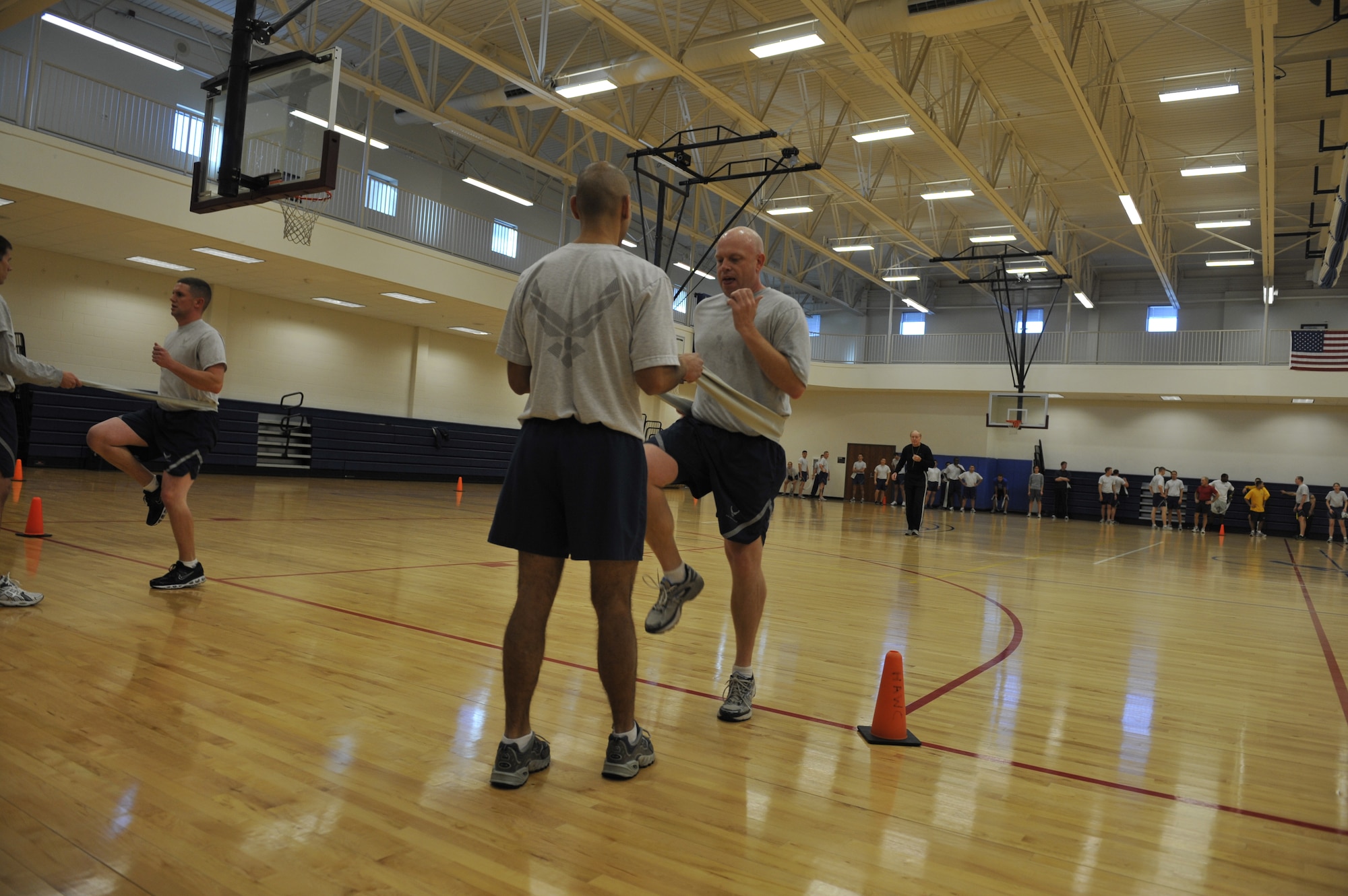 BUCKLEY AIR FORCE BASE, Colo-- U.S. Air Force service members direct each other during their workout, Dec. 7.  Members participated in the Military Exercise Leader Course which addresses the physical requirements of the military.  (U.S. Air Force photo by Airman 1st Class Riley Johnson)