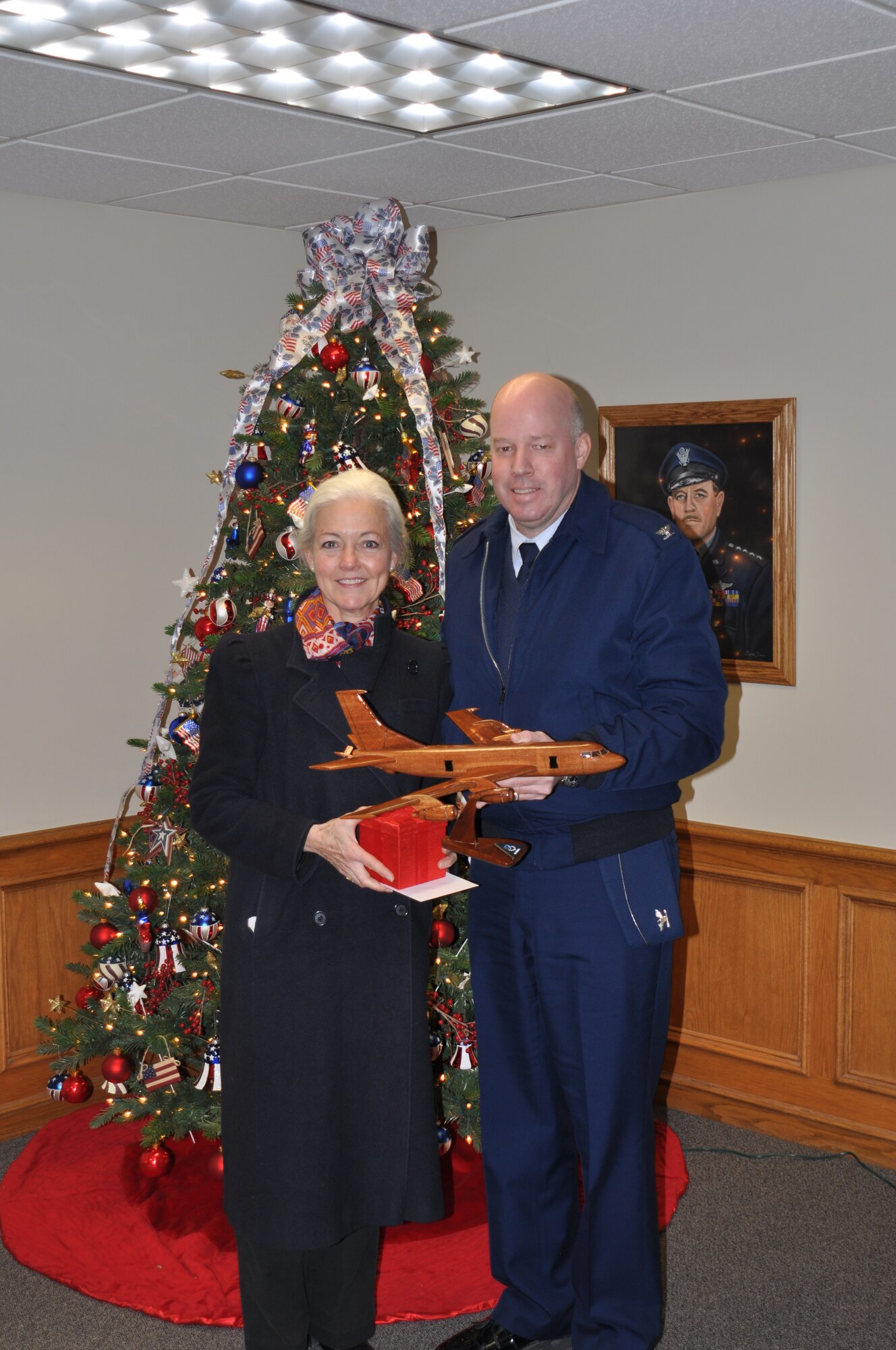 Col. Paul Guemmer, 92nd Air Refueling Wing commander, presents Mayor Mary Verner with a few mementos Dec. 12 on behalf of Fairchild for her support of the base over the past  four years. Guemmer led Verner on a tour of Fairchild showing her all the recent construction projects including the new fitness center and medical group facilities. (U.S. Air Force photo/Scott King)