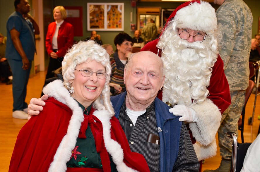 Airmen from the 337th Airlift Squadron, Westover Air Reserve Base, bring
cookies and holiday cheer to veterans at the Holyoke Soldiers' Home Dec. 15.